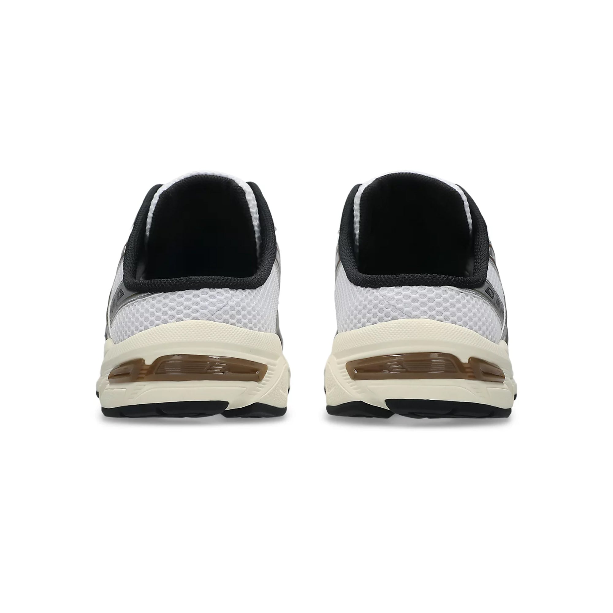 white, brown and silver sneaker mule on a white background