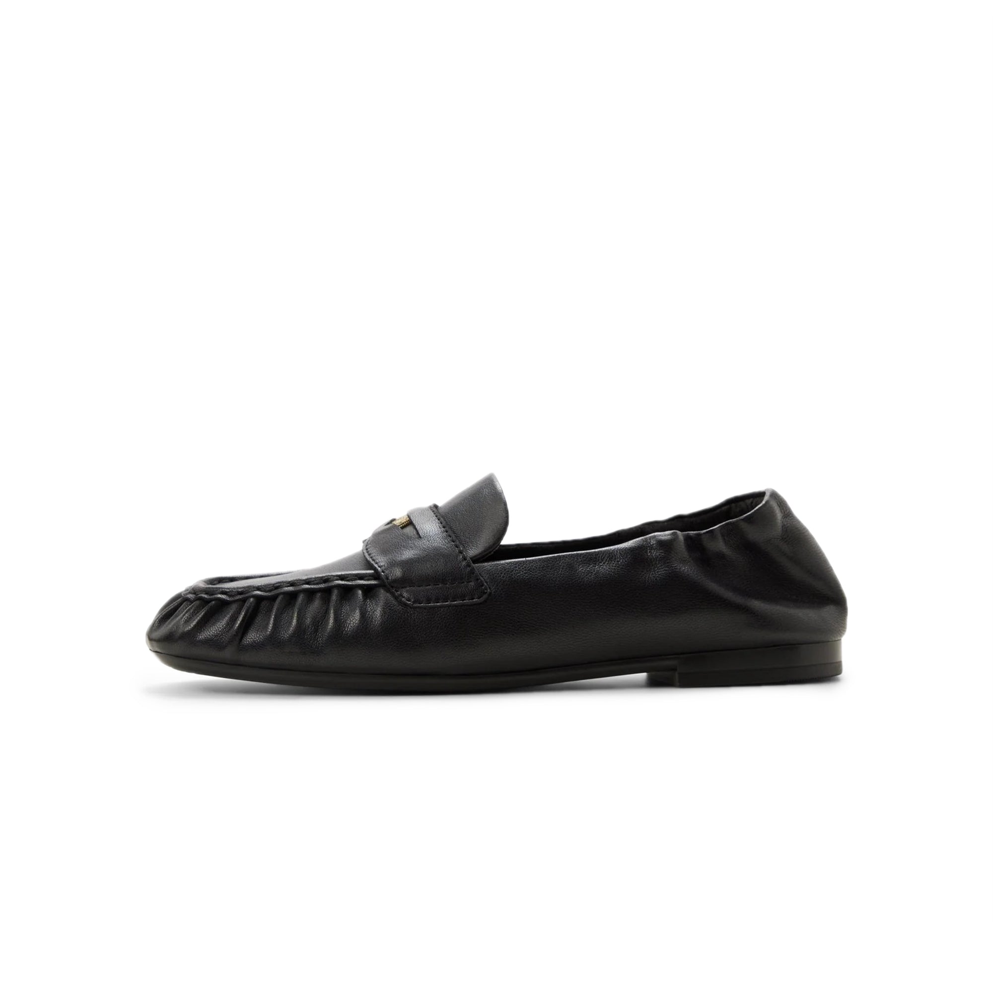 black penny loafers on a white background