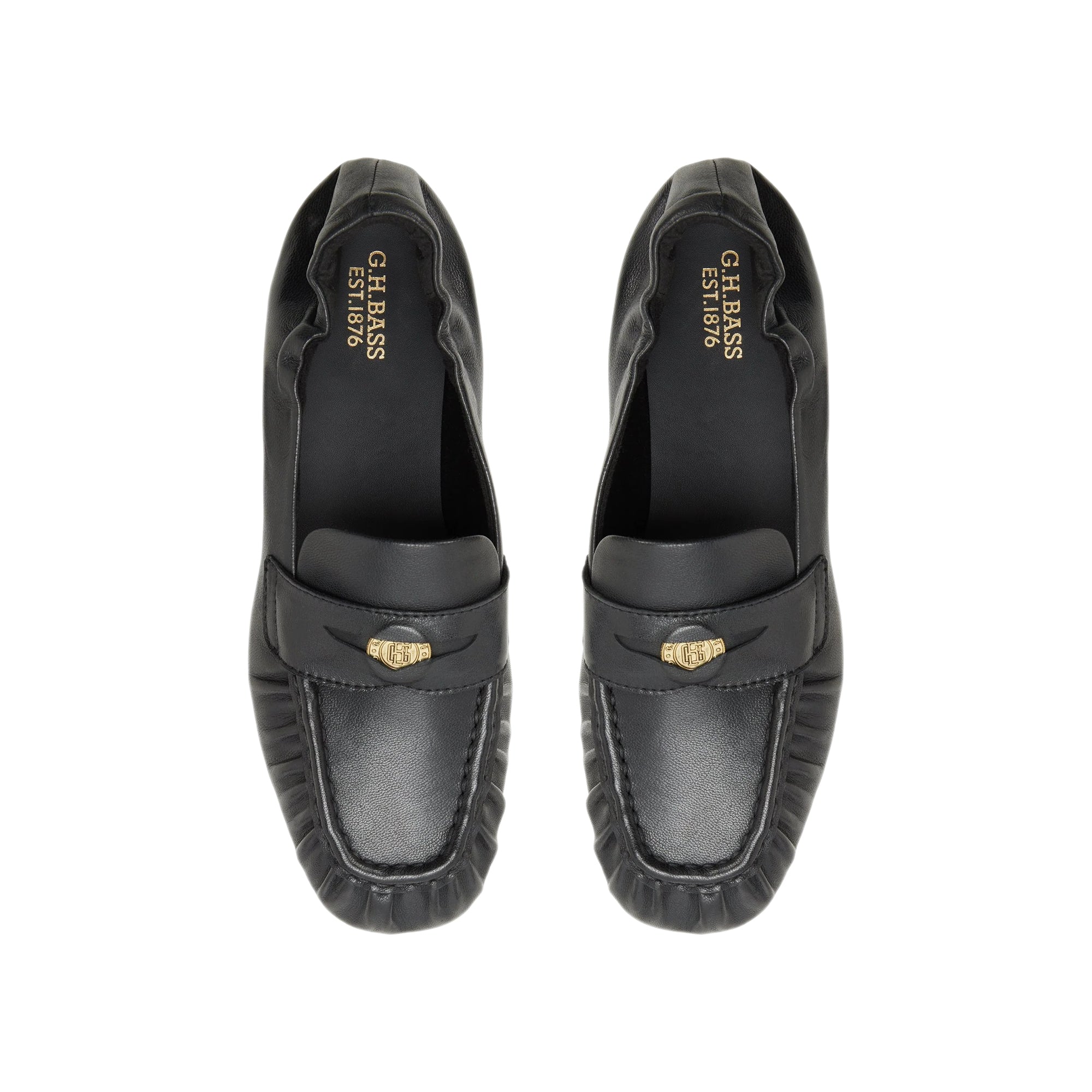 black penny loafers on a white background