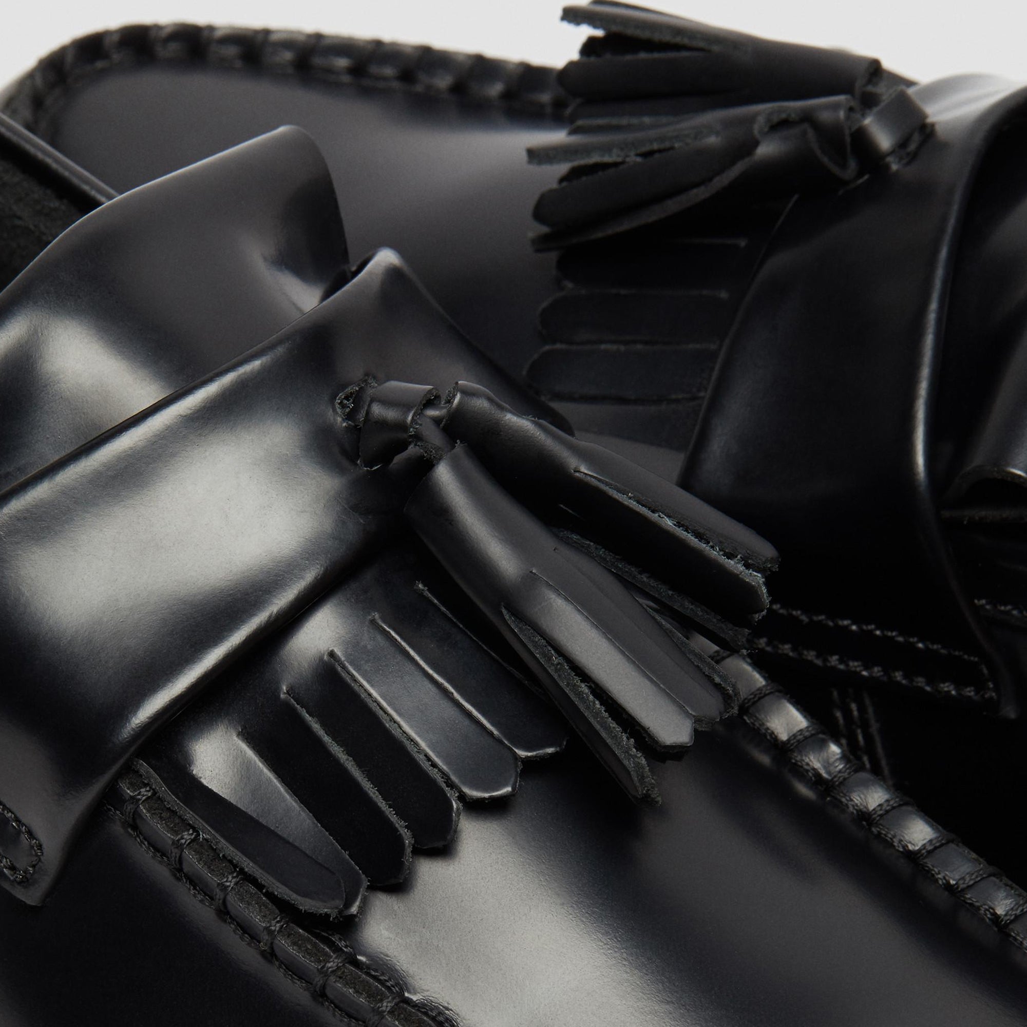 black loafers on a white background