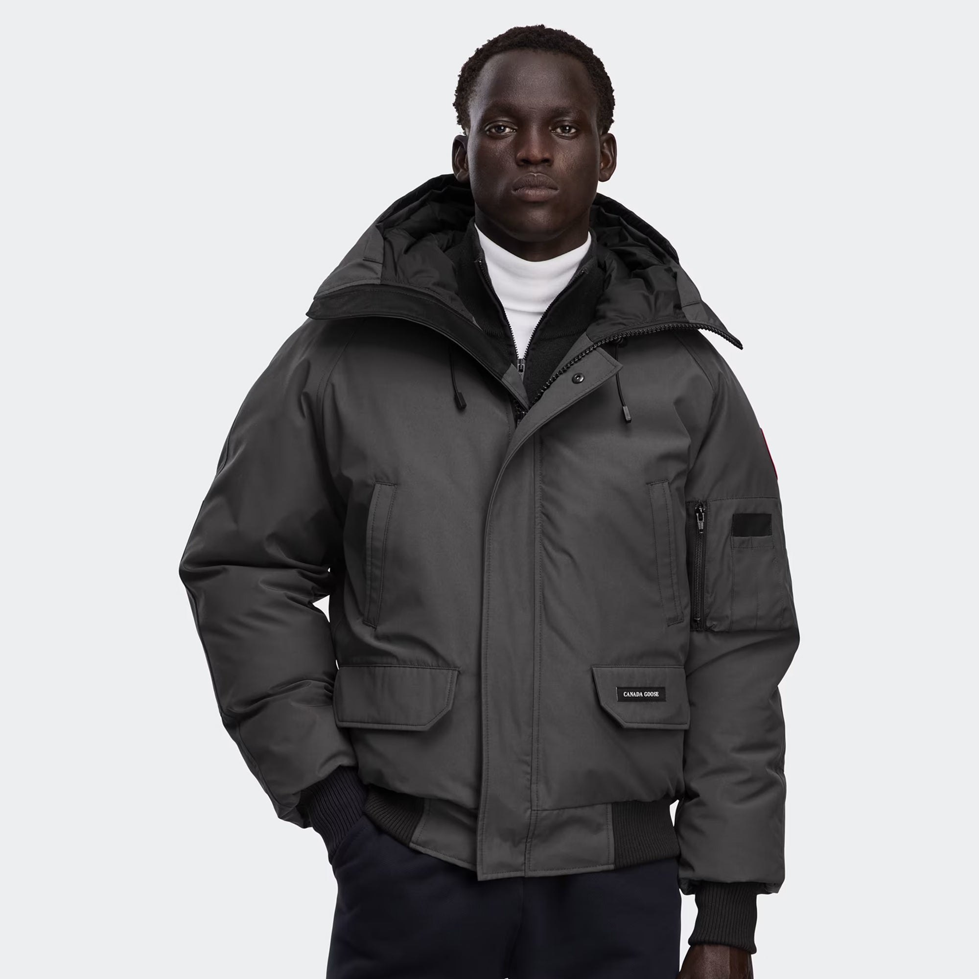 grey and black jacket on a white background