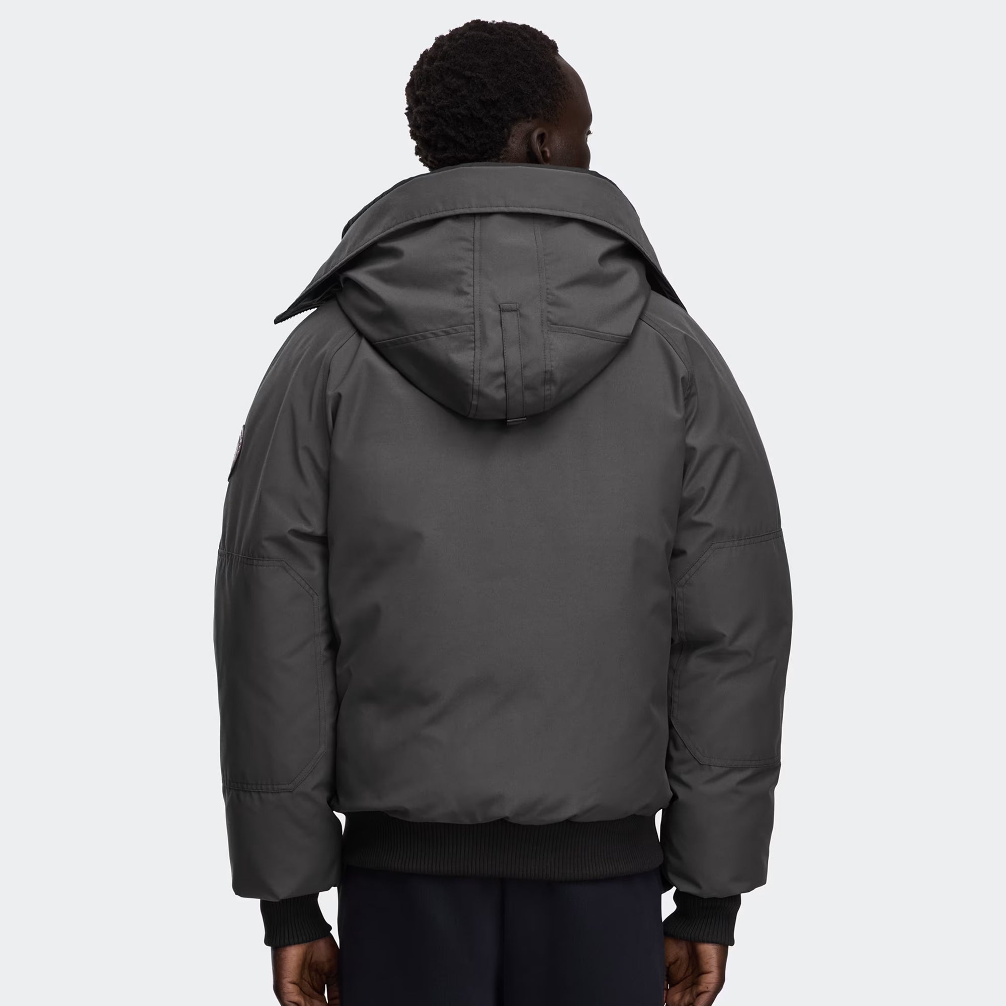 grey and black jacket on a white background