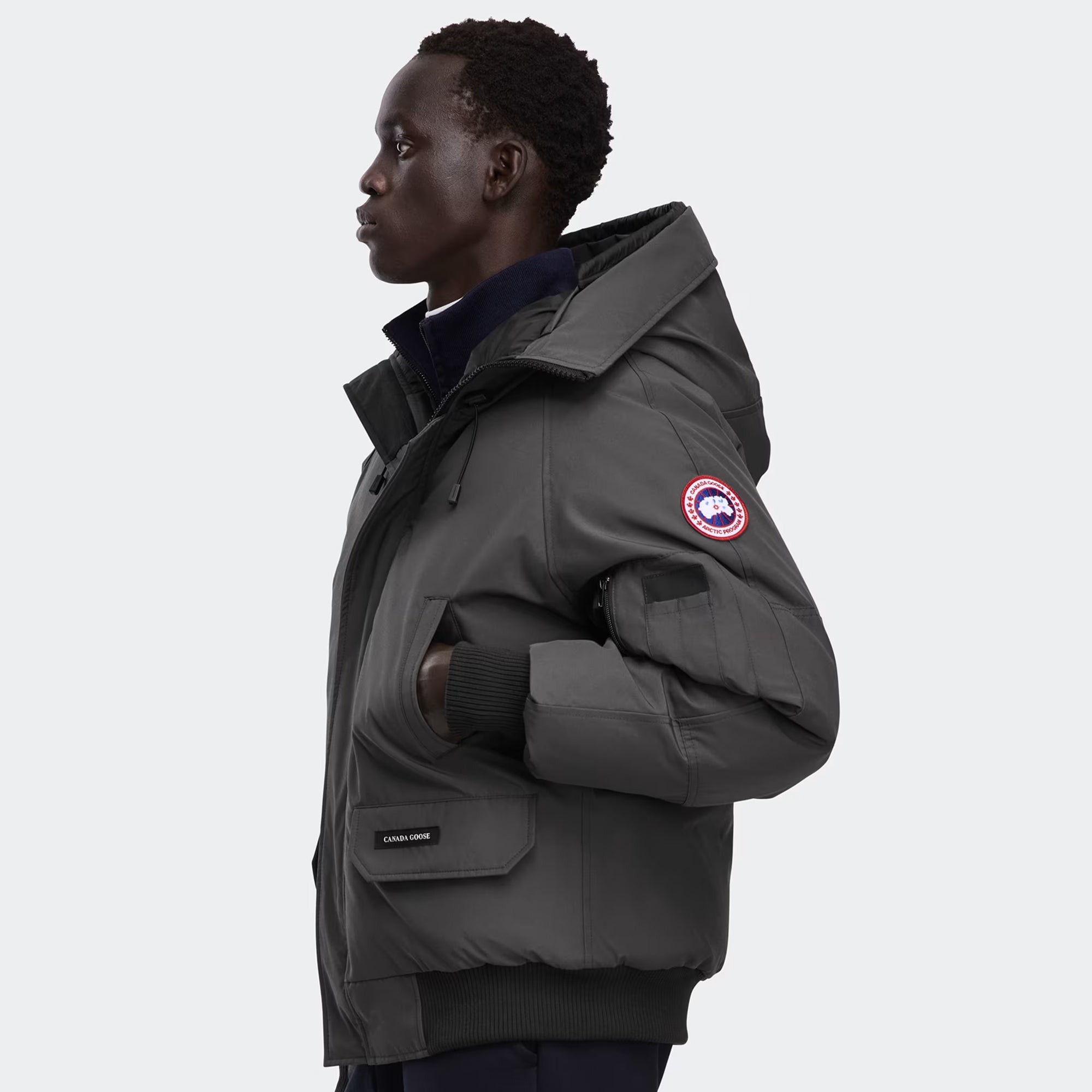 grey and black jacket on a white background