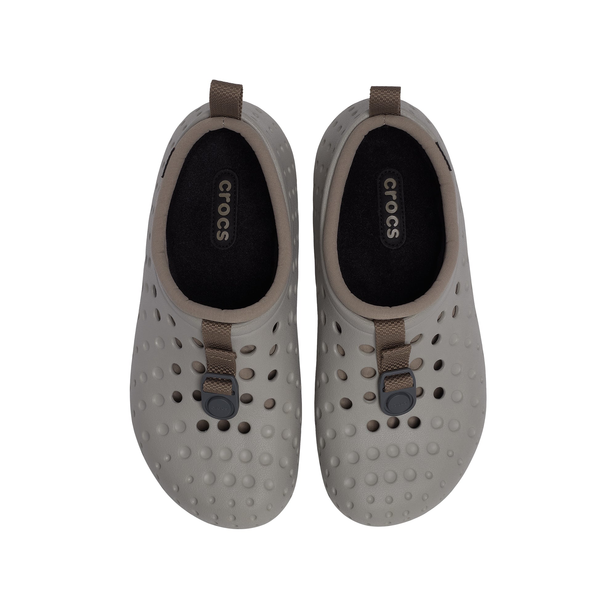 Grey and taupe clogs on a white background