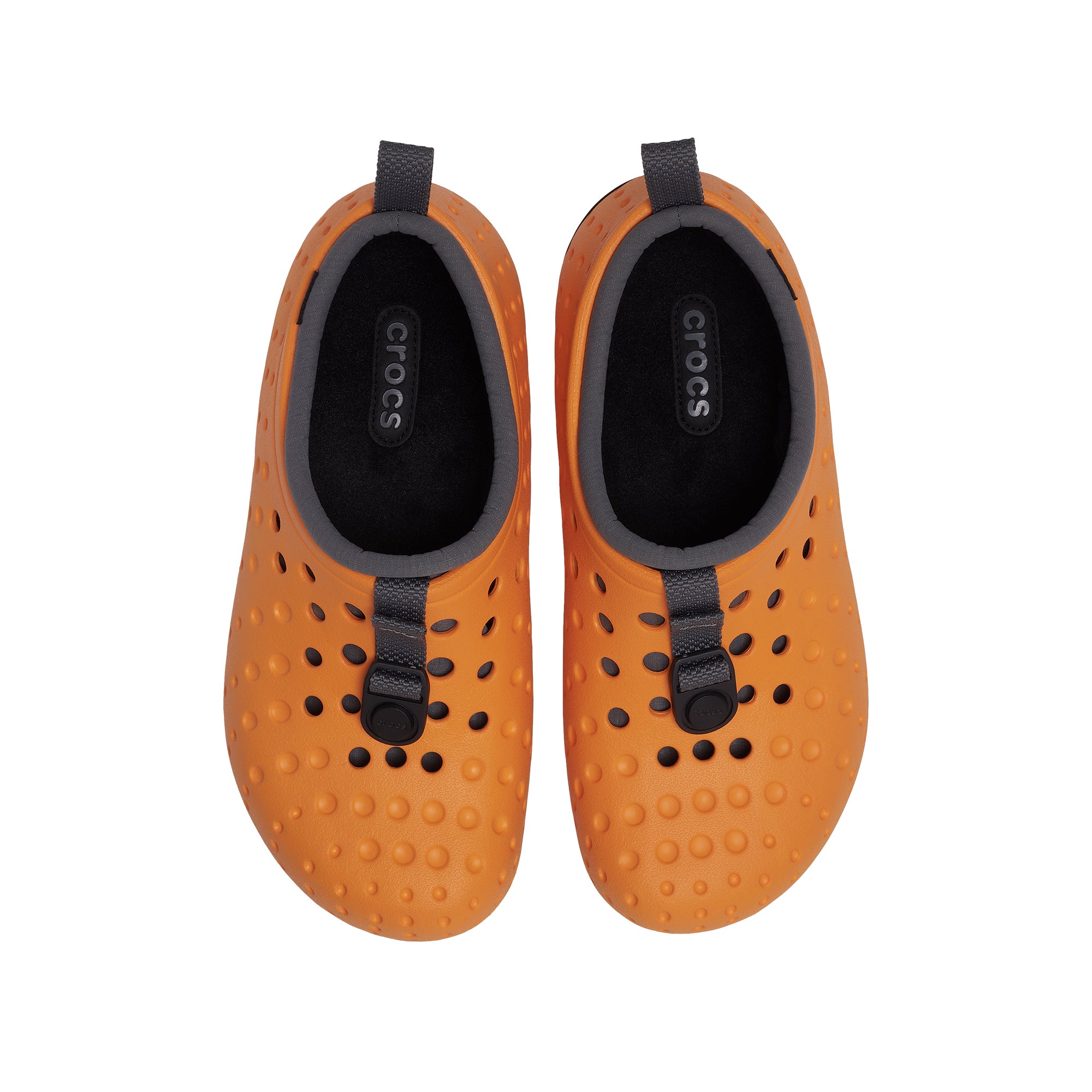 orange and black clogs on a white background