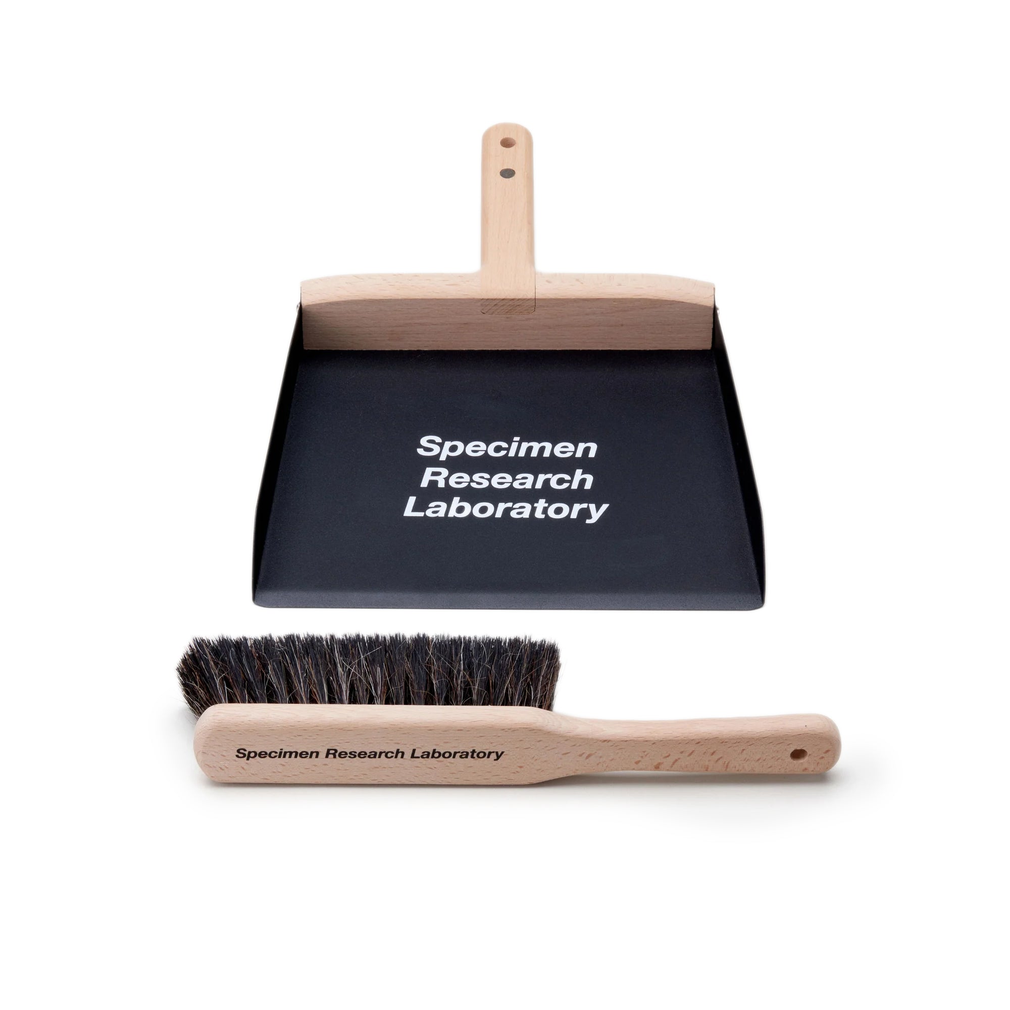Brush with dust pan on white background