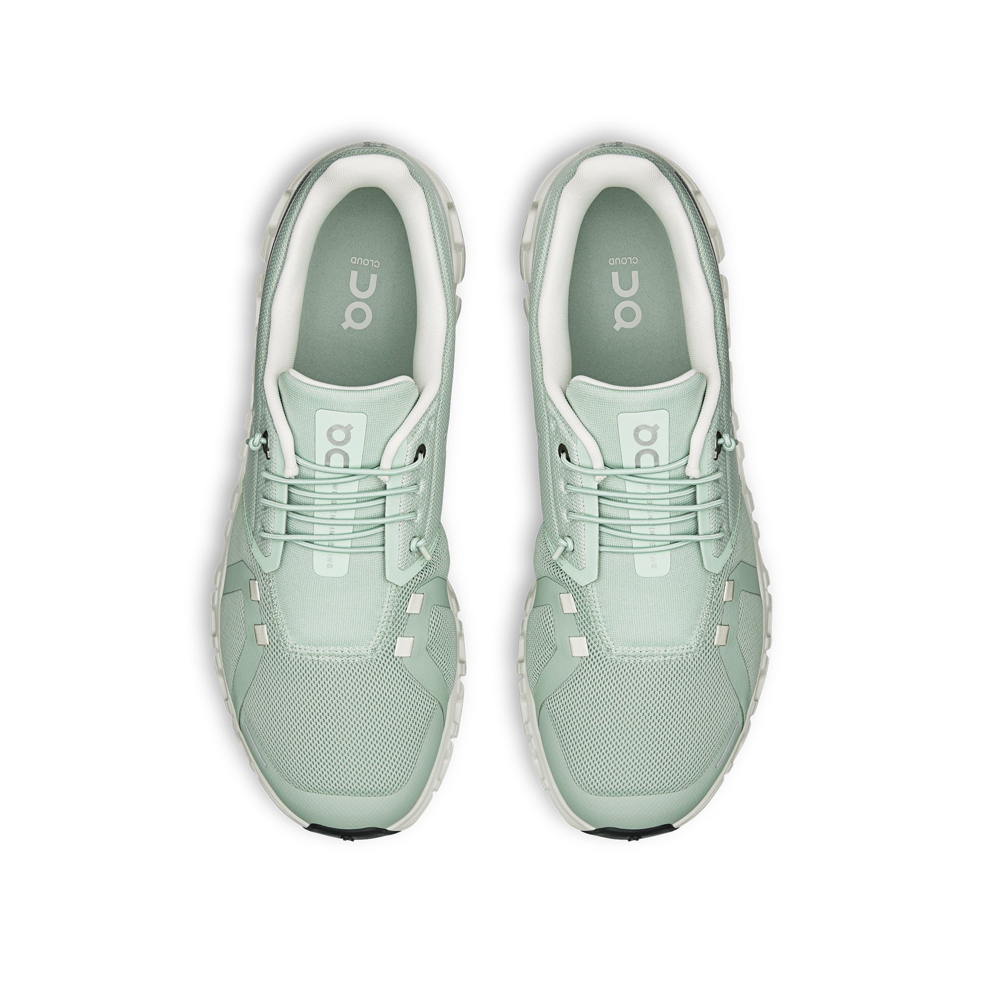 mint green and white sneakers on a white background