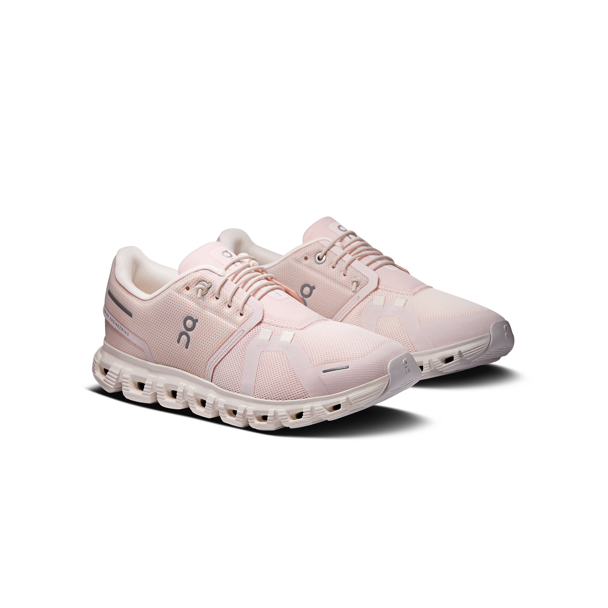 pink and white sneakers on a white background