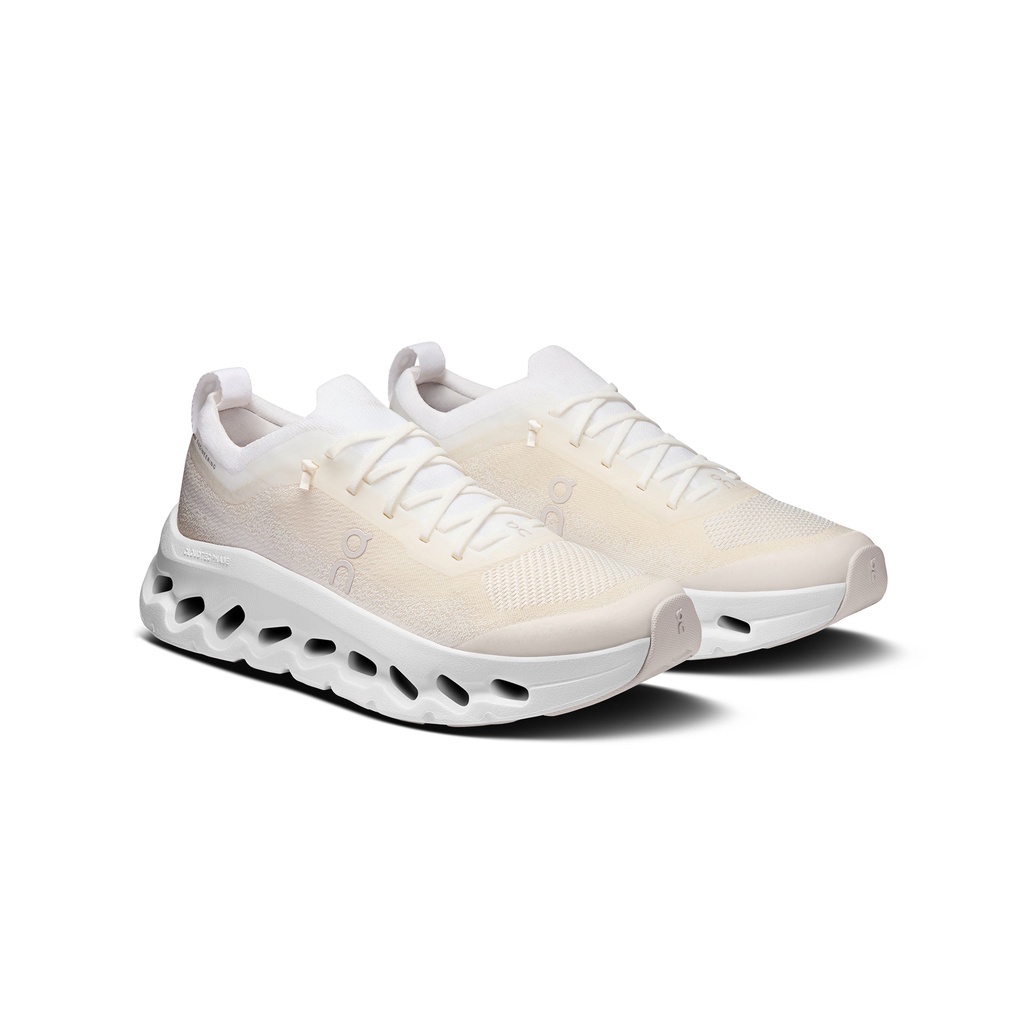 white tan sneakers on a white background