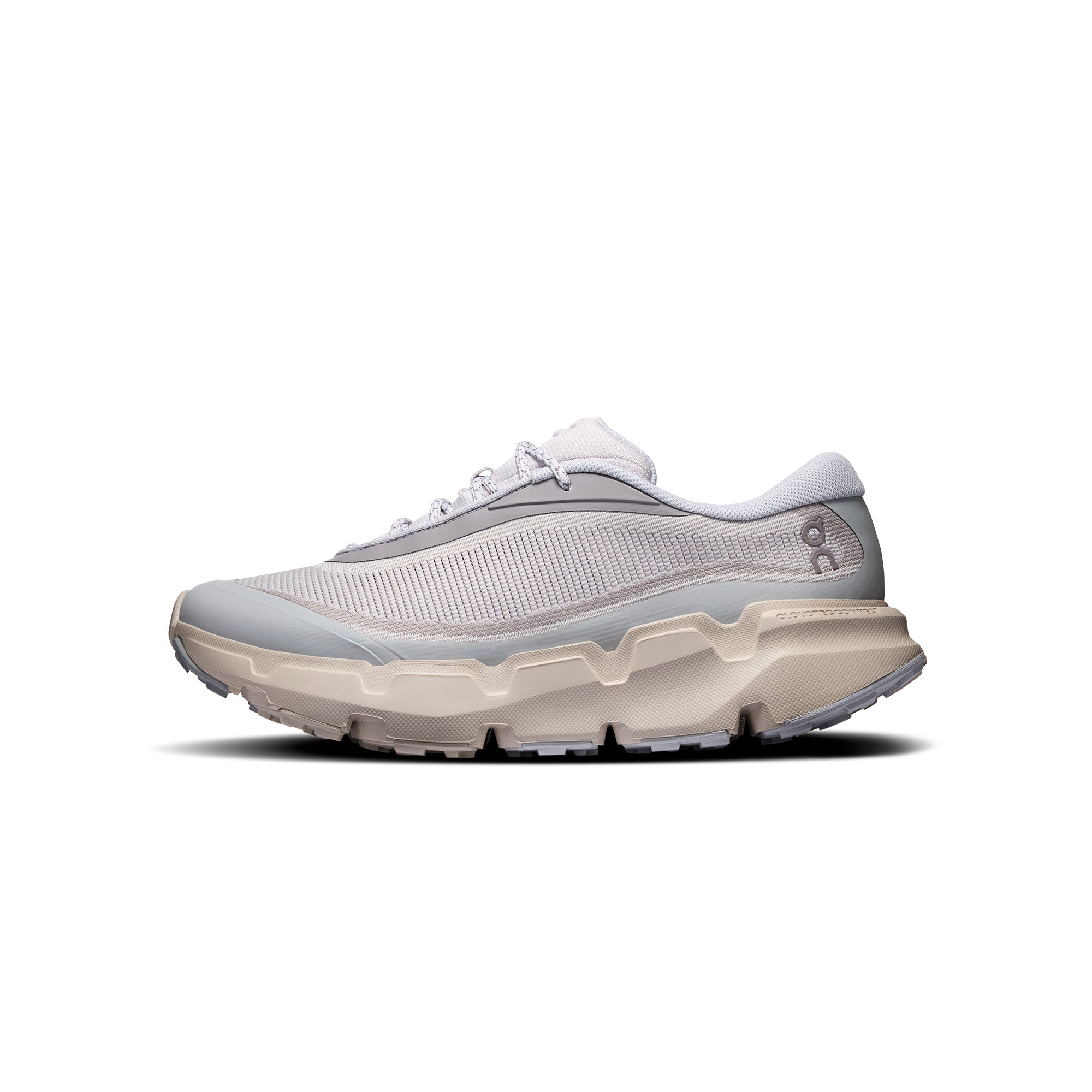 white grey light blue and beige sneakers on a white background