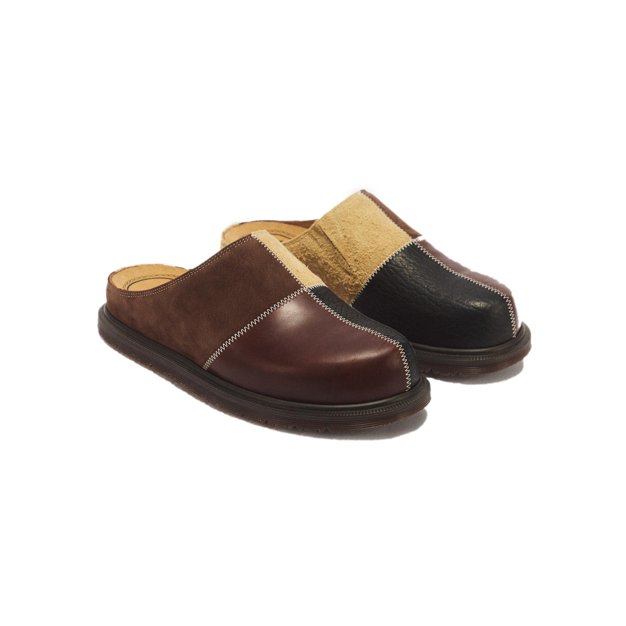 Butterscotch dark Mules on a white background
