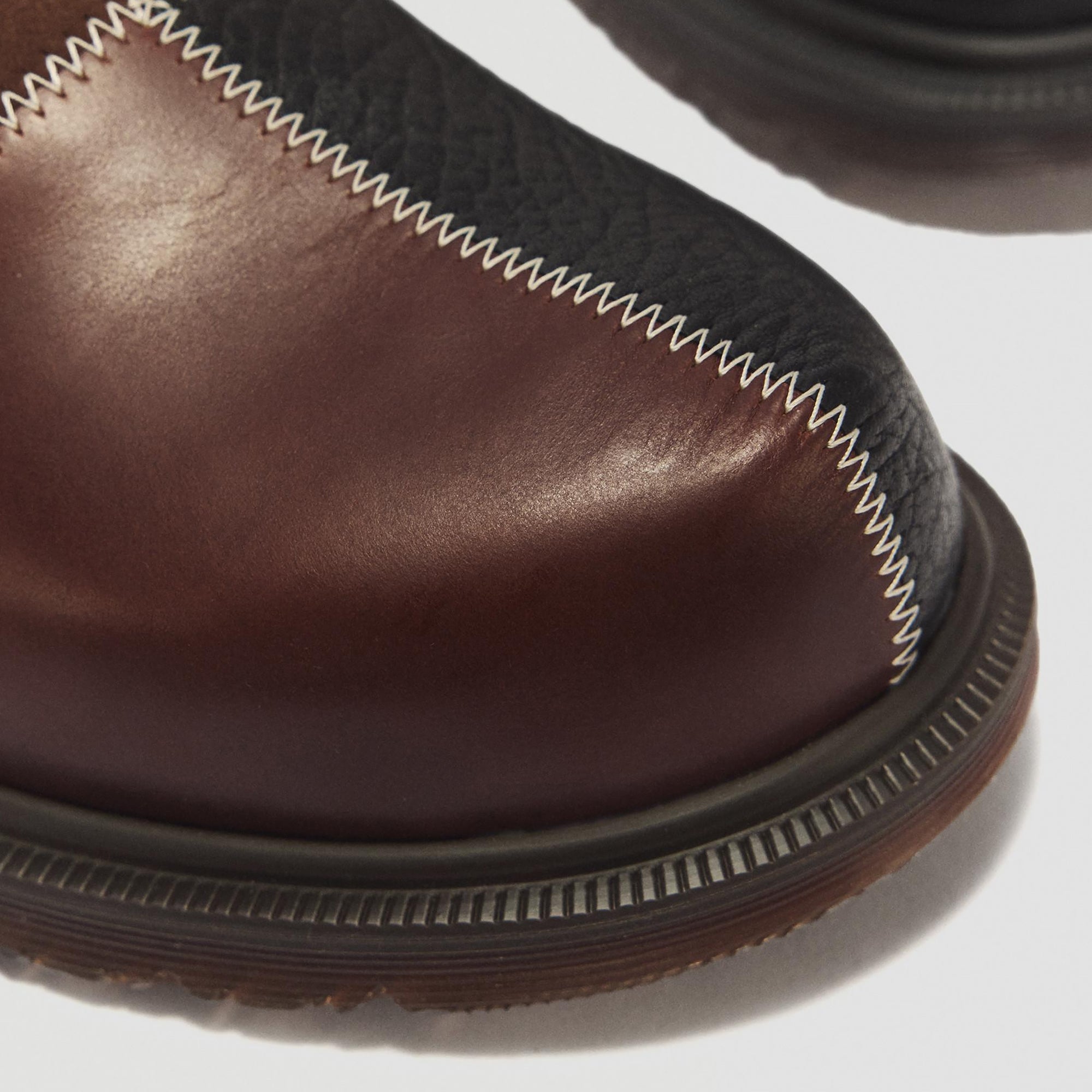 Butterscotch dark Mules on a white background