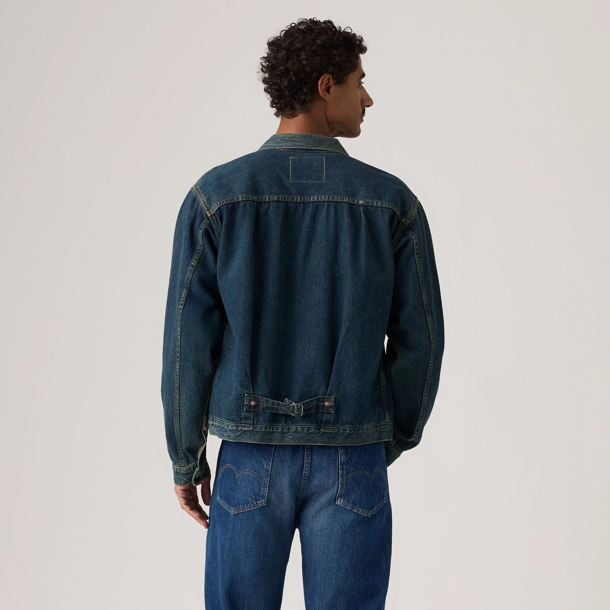 person wearing an Indigo Jacket on a white background