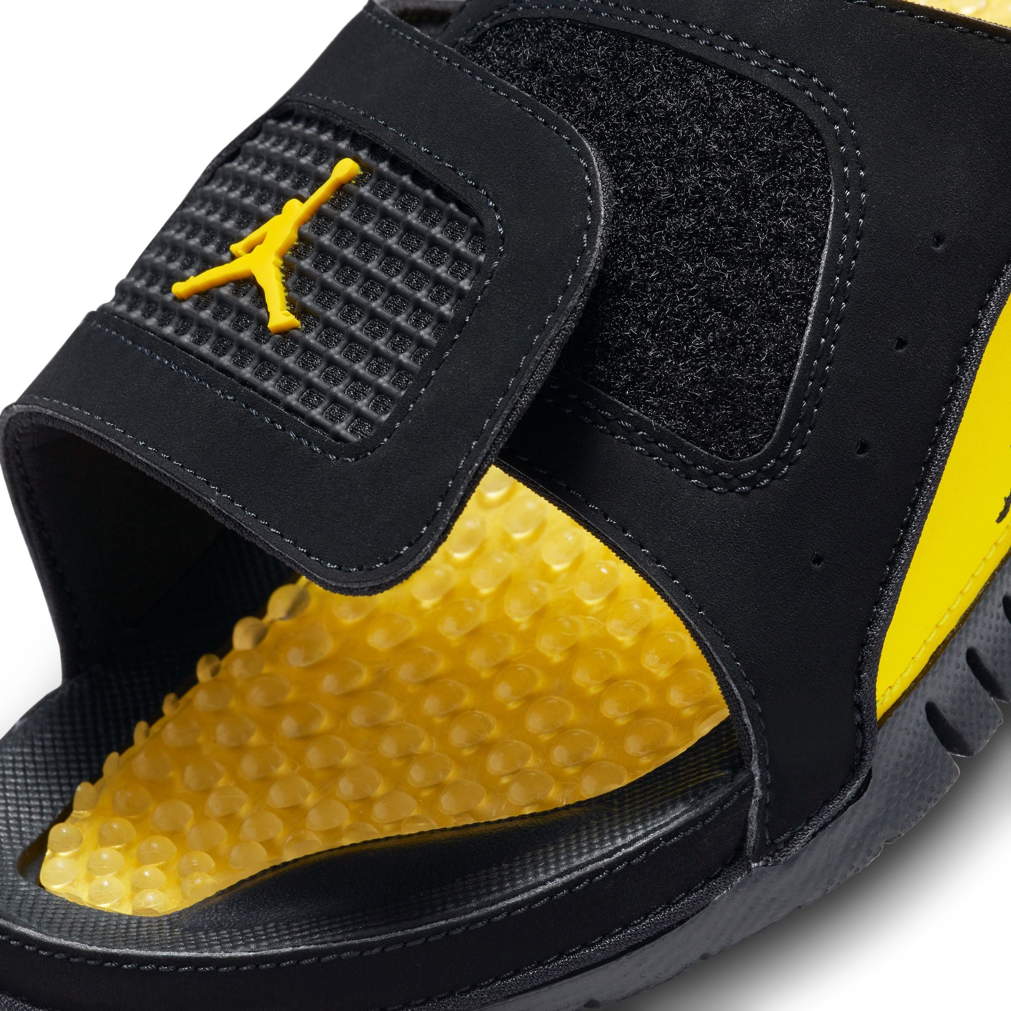 Black/tour Yellow Slides on a white background