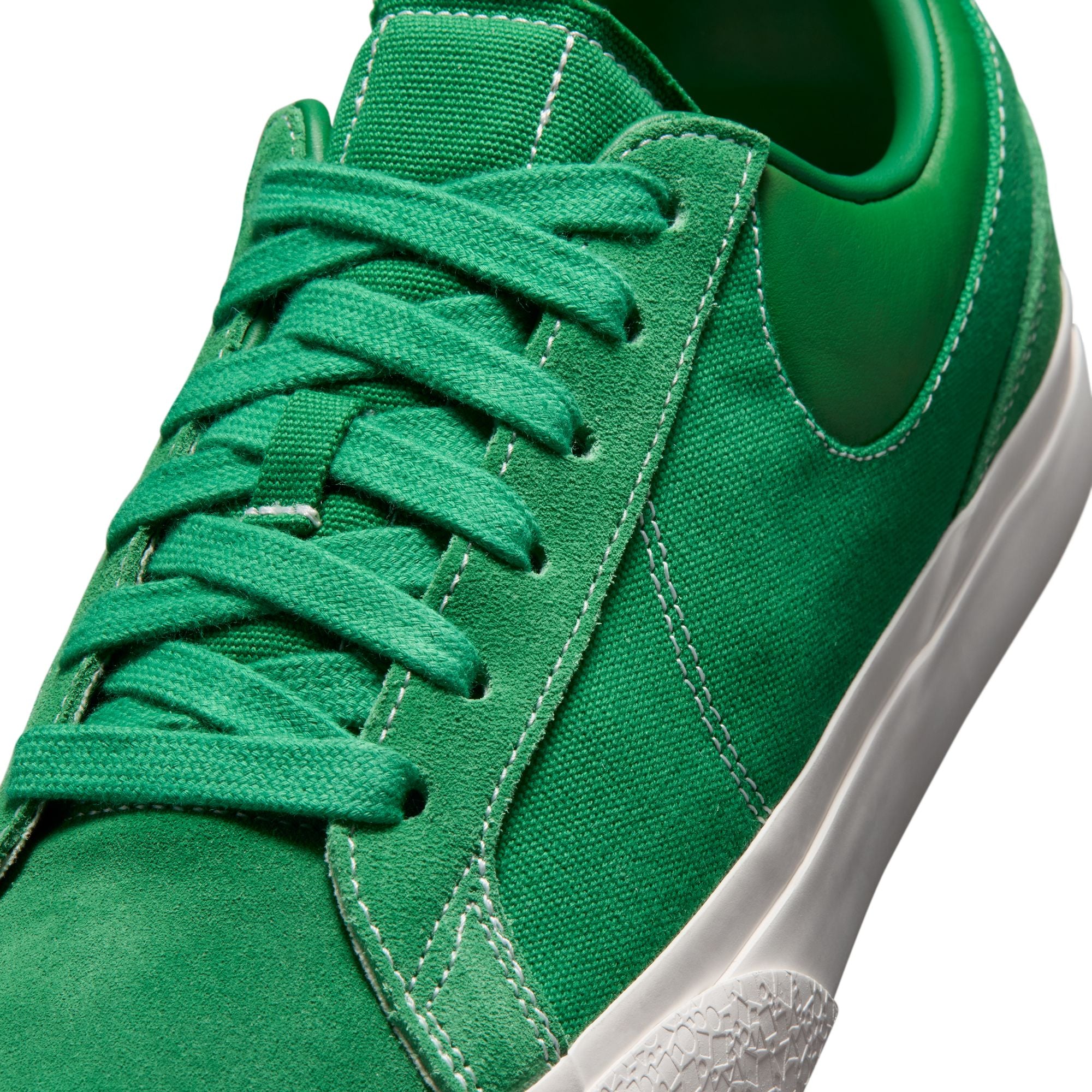 pine green and white sneakers on a white background