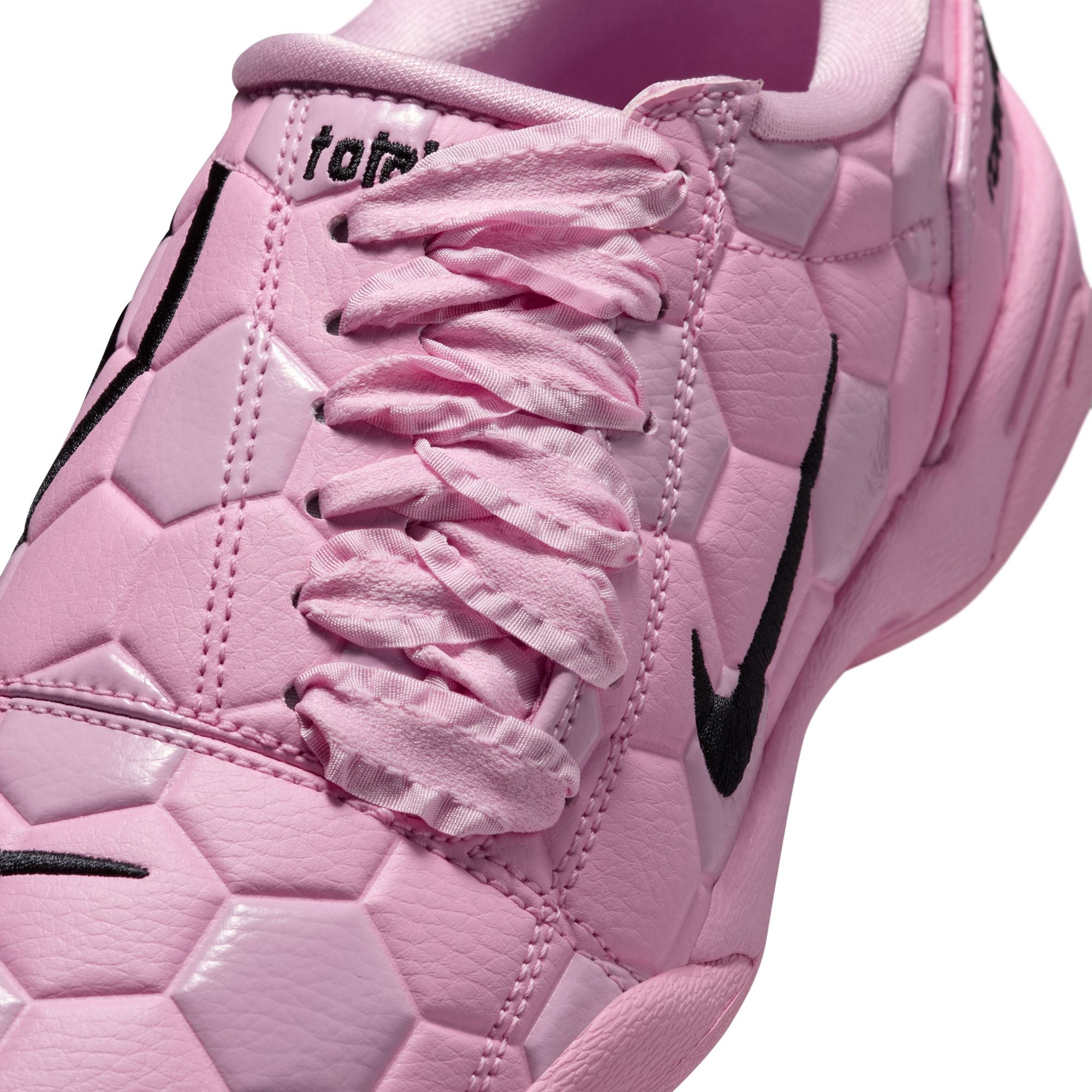 pink and black sneakers on a white background