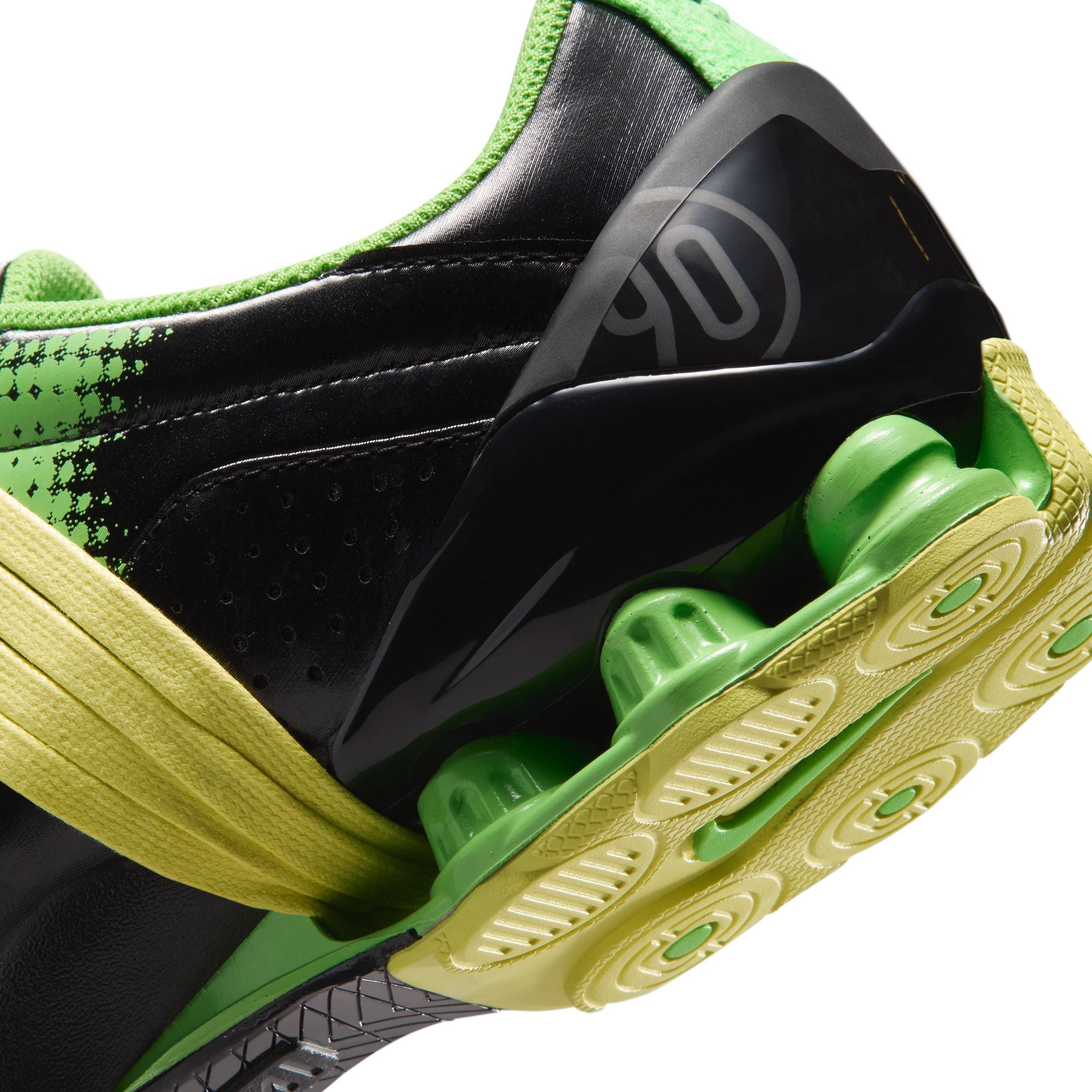 black green and yellow sneakers on a white background