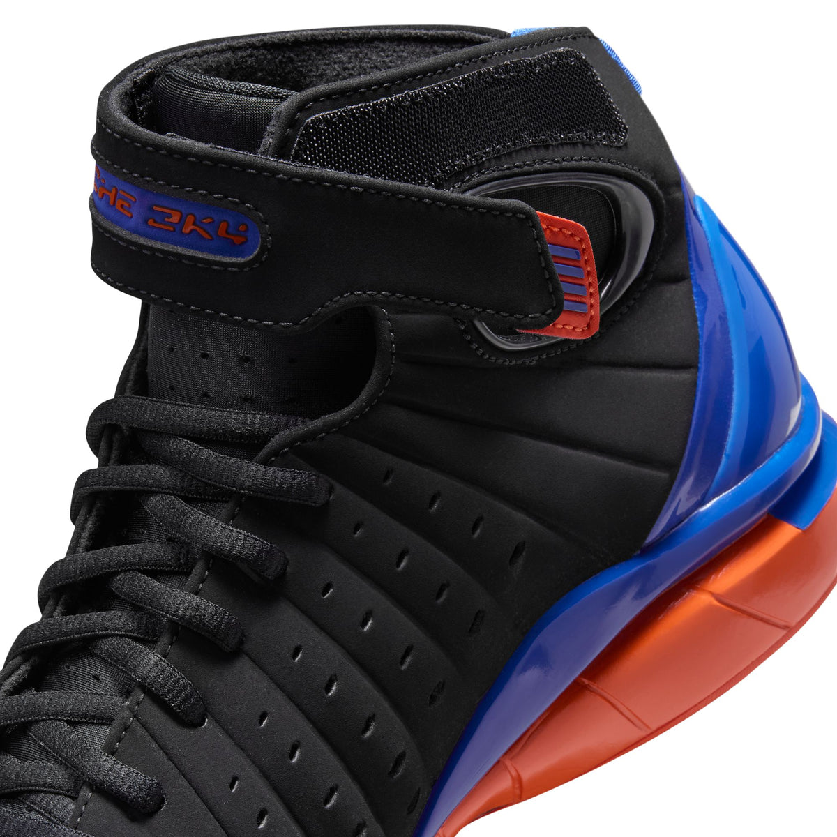 Black/varsity Royal-safety Orange Sneakers on a white background