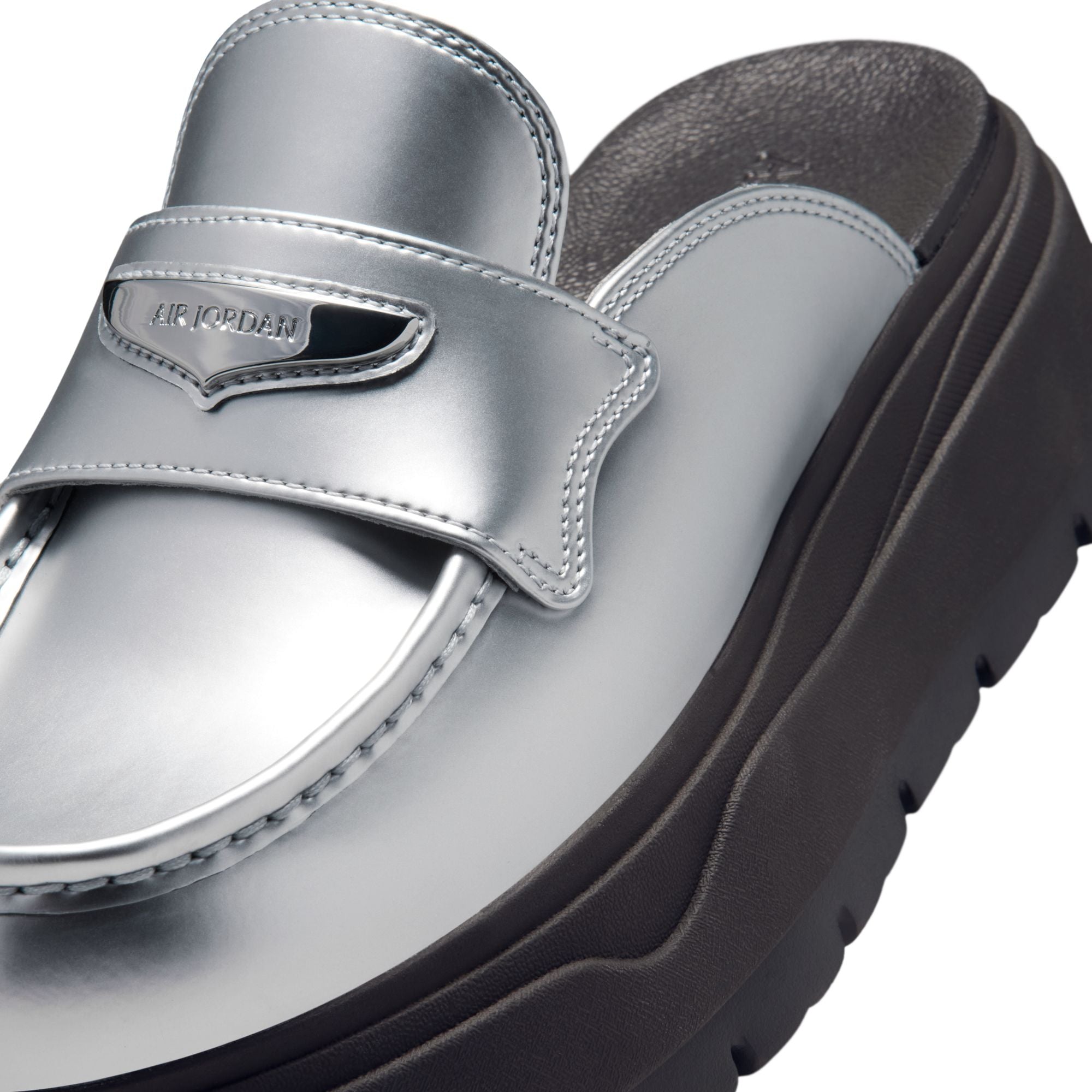 Metallic Silver and black Mule on a white background