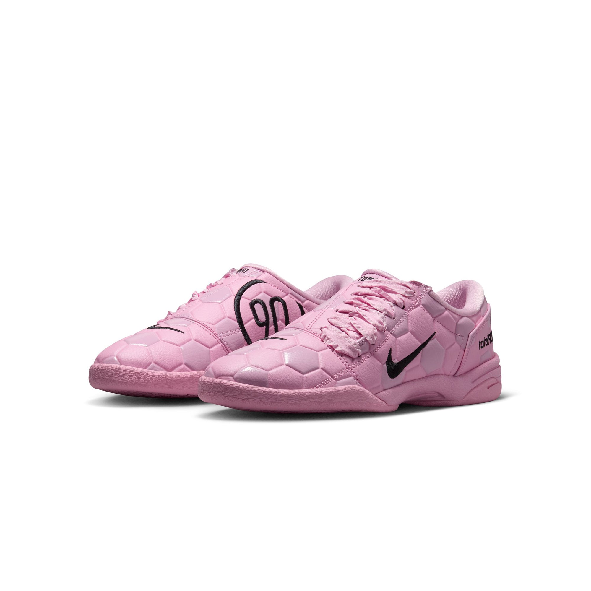 pink and black sneakers on a white background