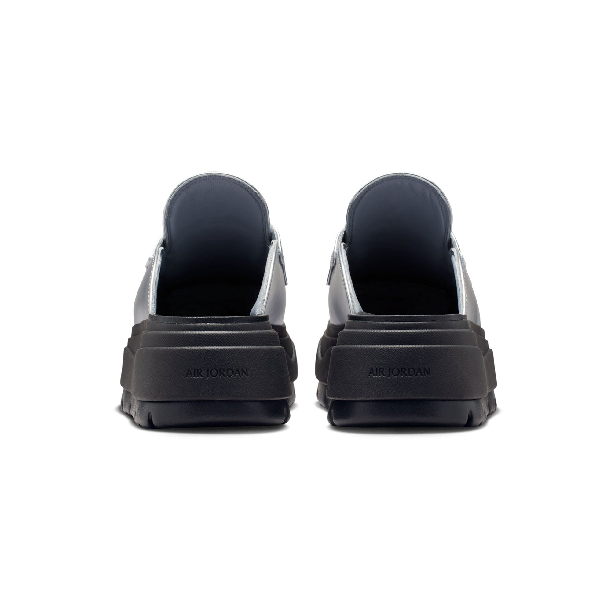 Metallic Silver and black Mule on a white background