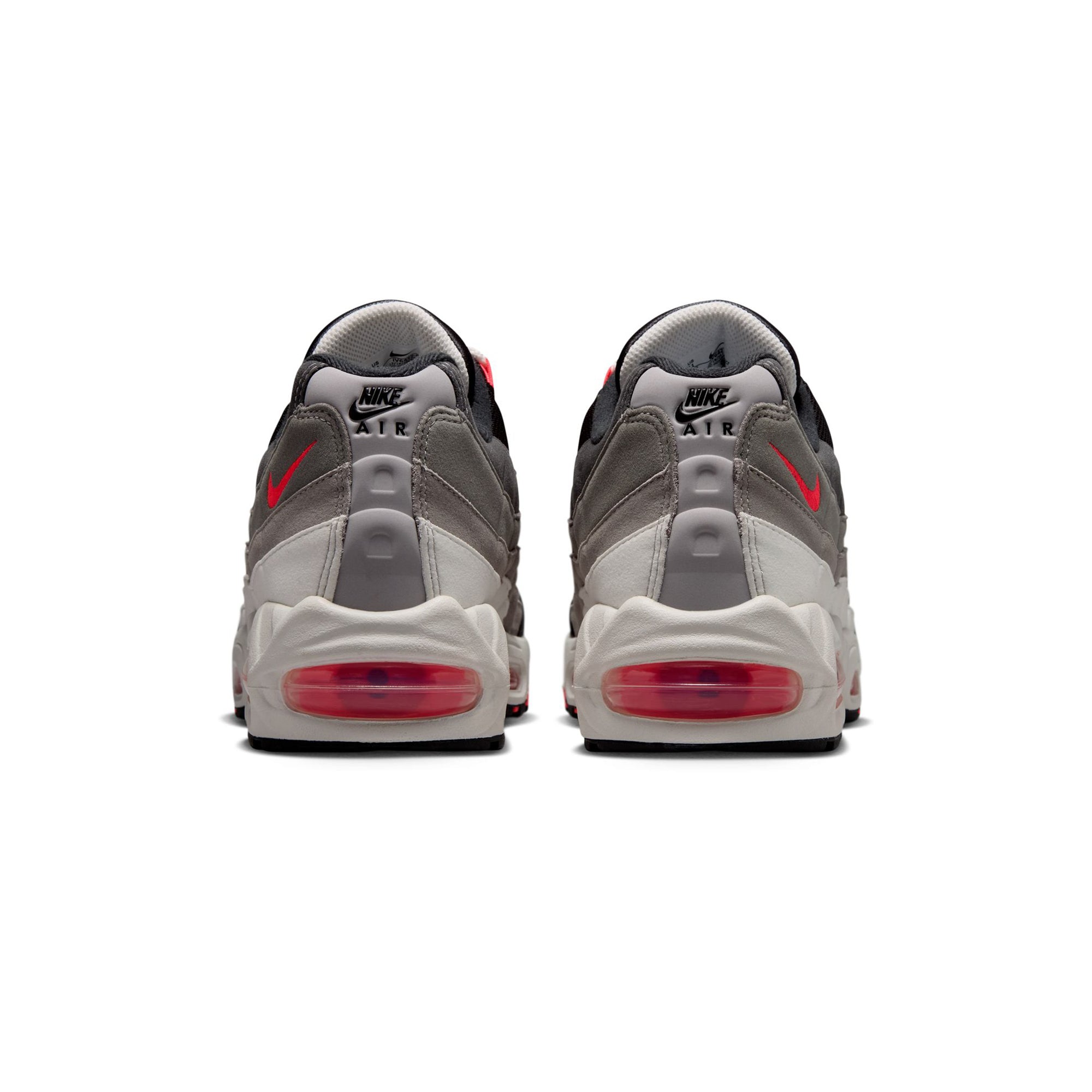 solar red, grey, black and white sneakers on a white background