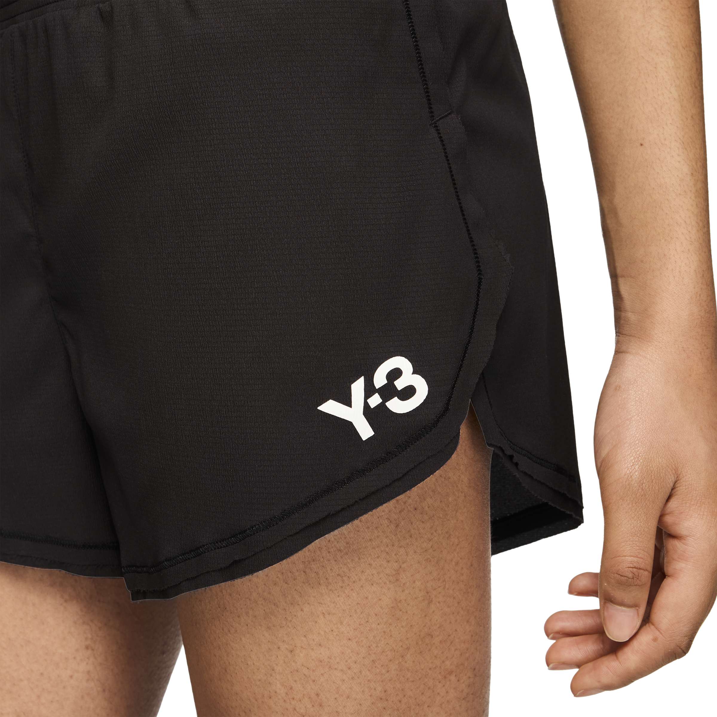 person wearing a black and white shorts on a white background