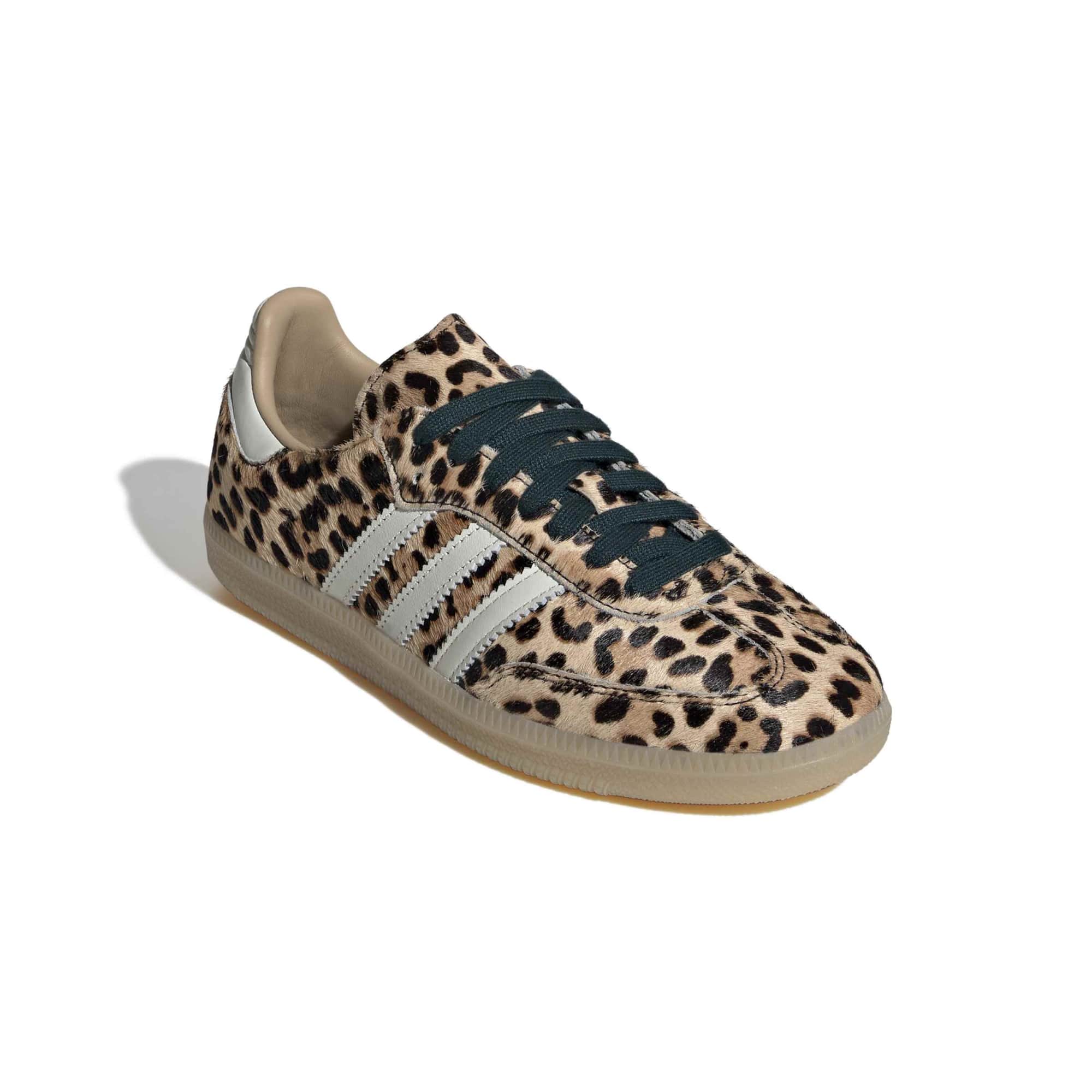 cheetah print sneakers on a white background