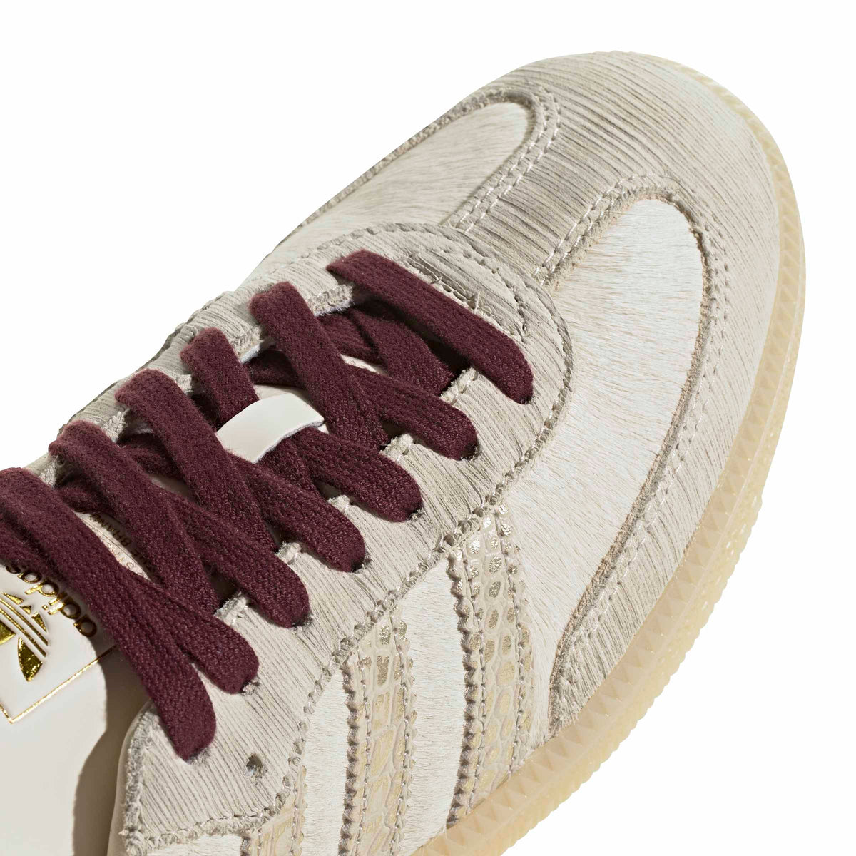 Cream White/ Maroon Sneakers on a white background