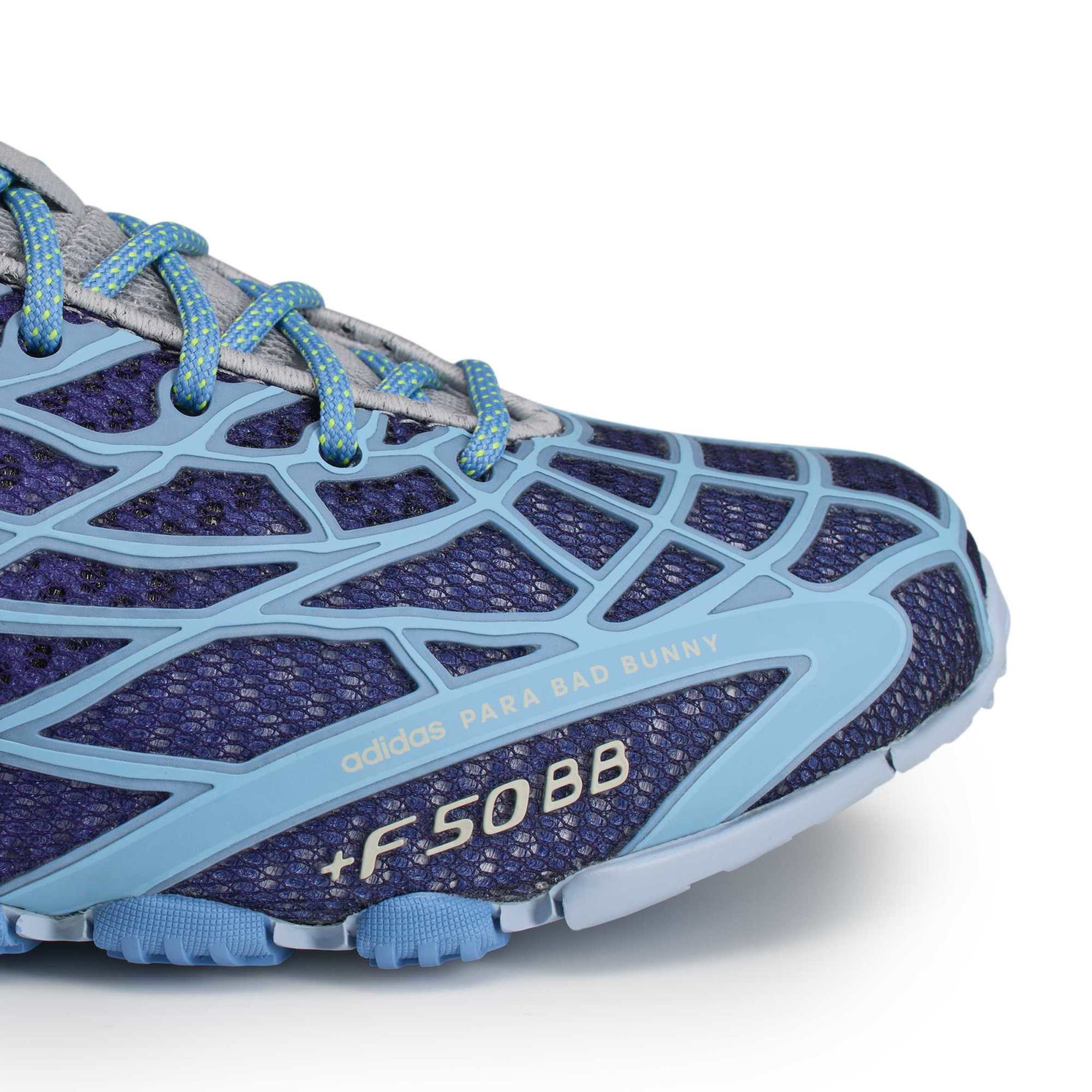 blue, purple and grey sneakers on a white background