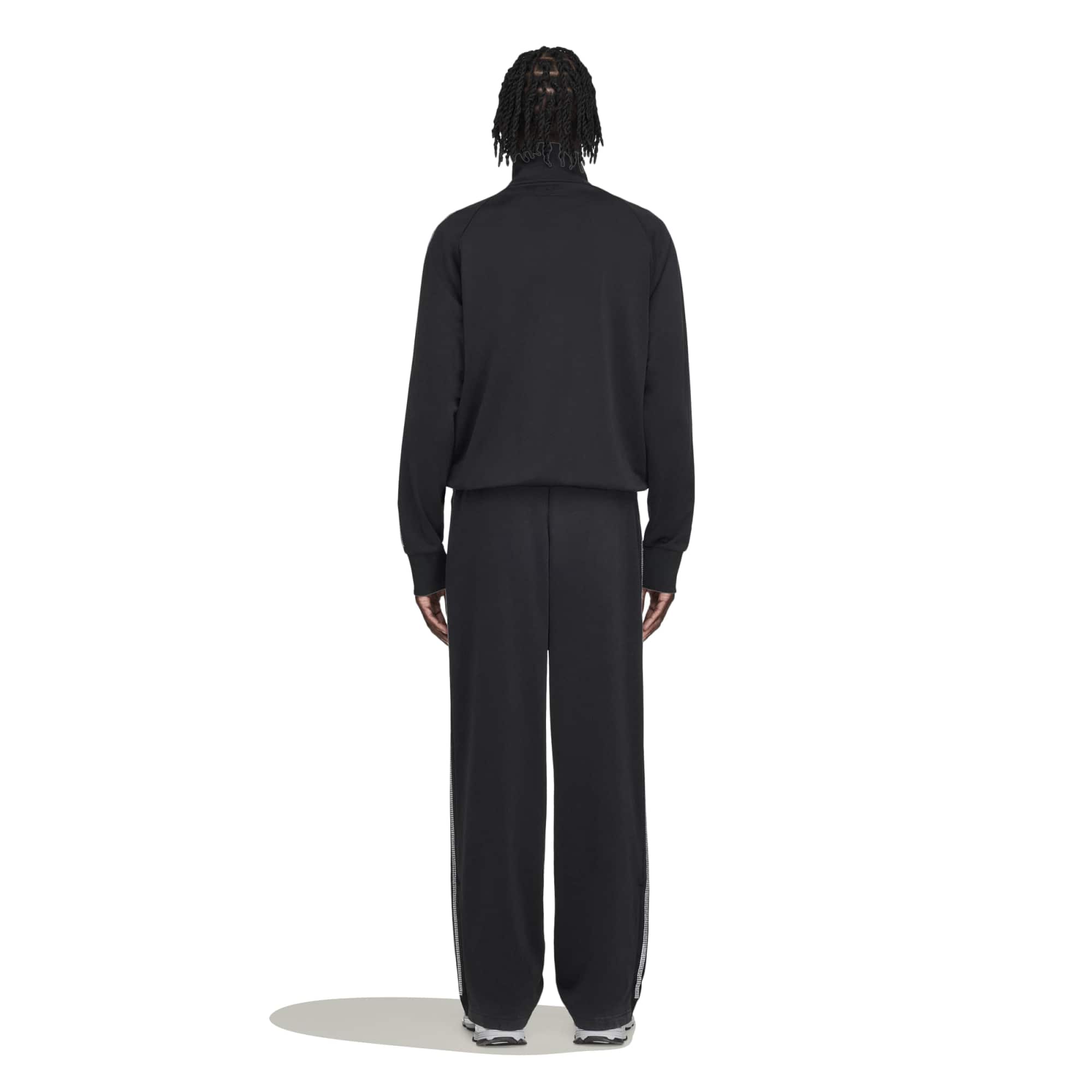 black and silver rhinestone track pants on a white background