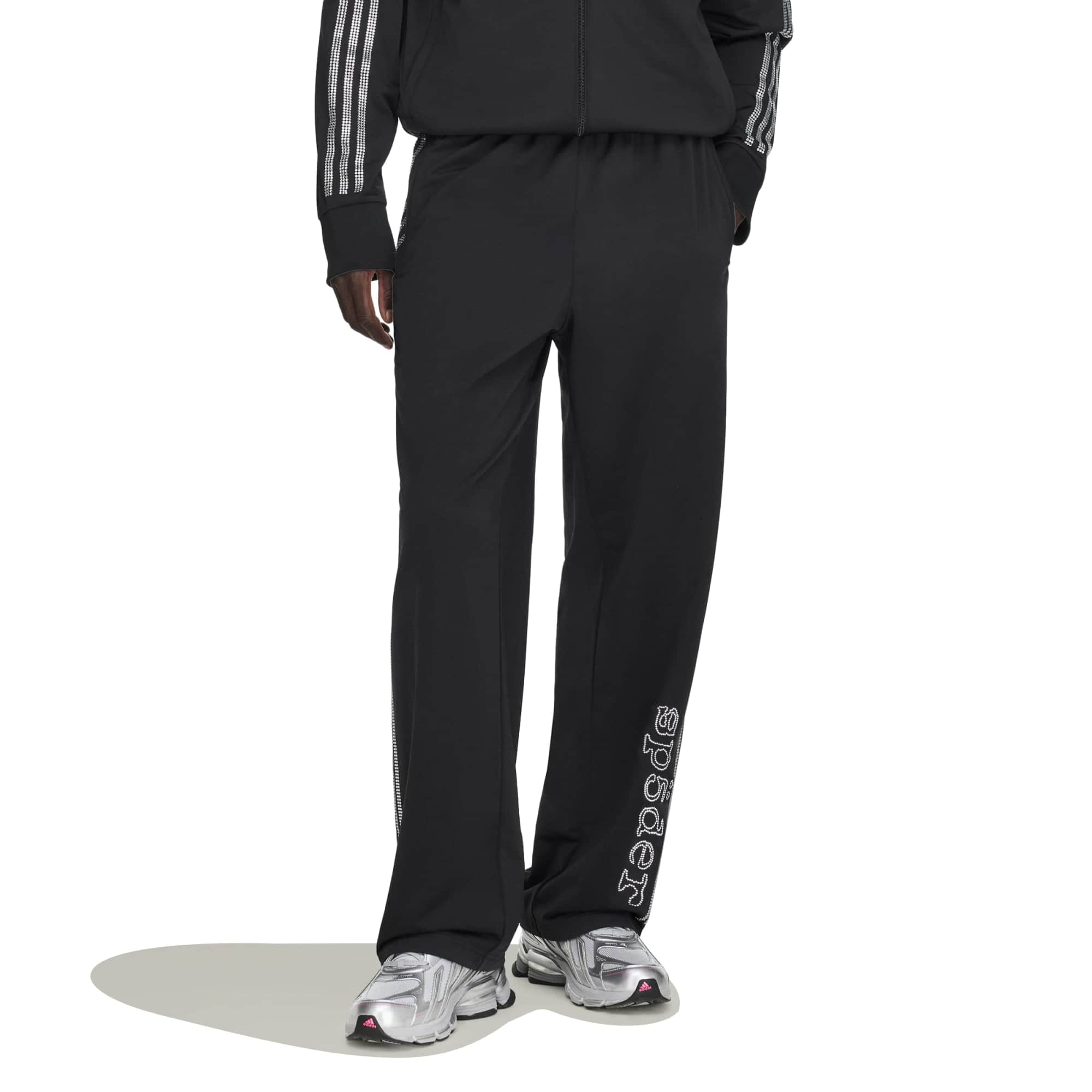 black and silver rhinestone track pants on a white background