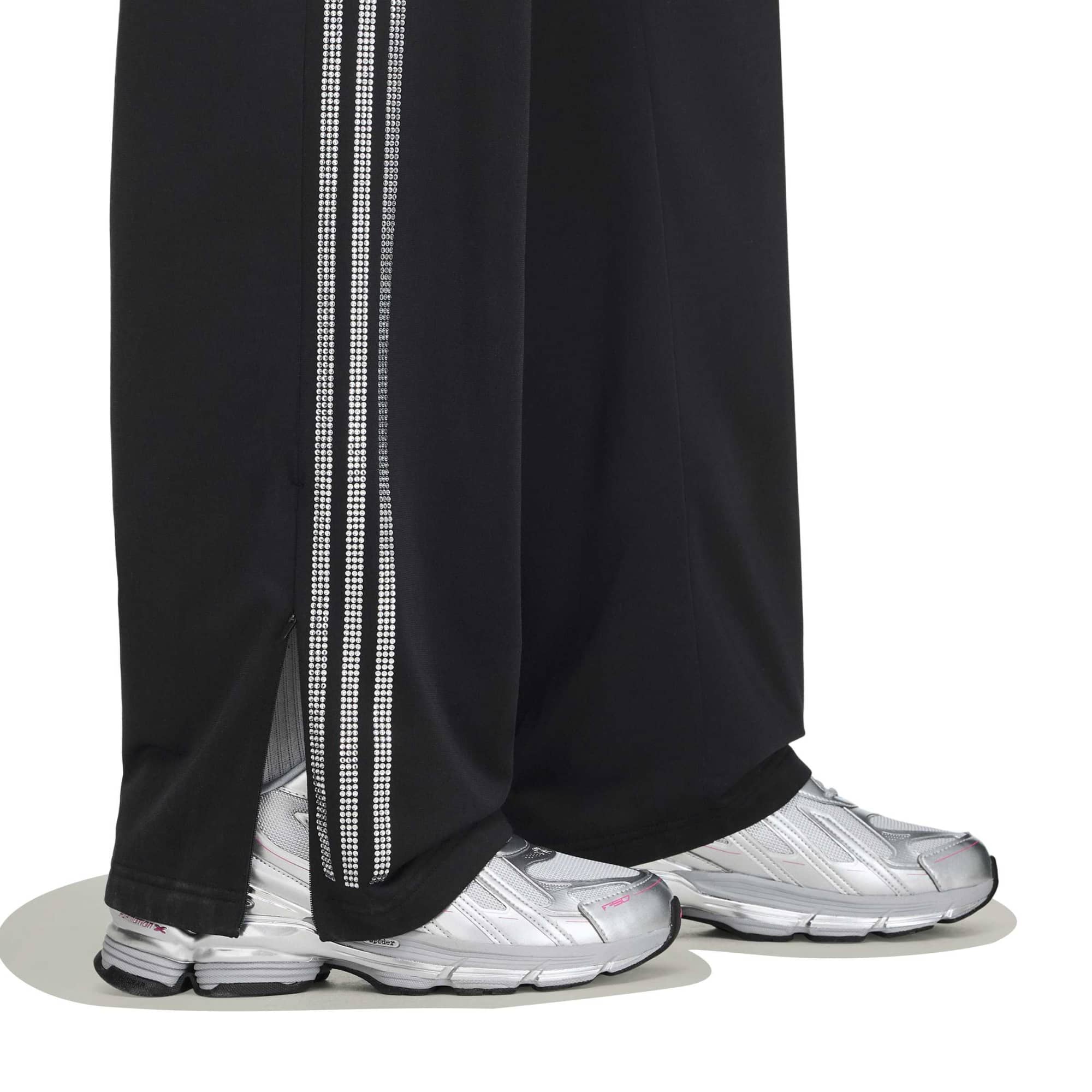 black and silver rhinestone track pants on a white background