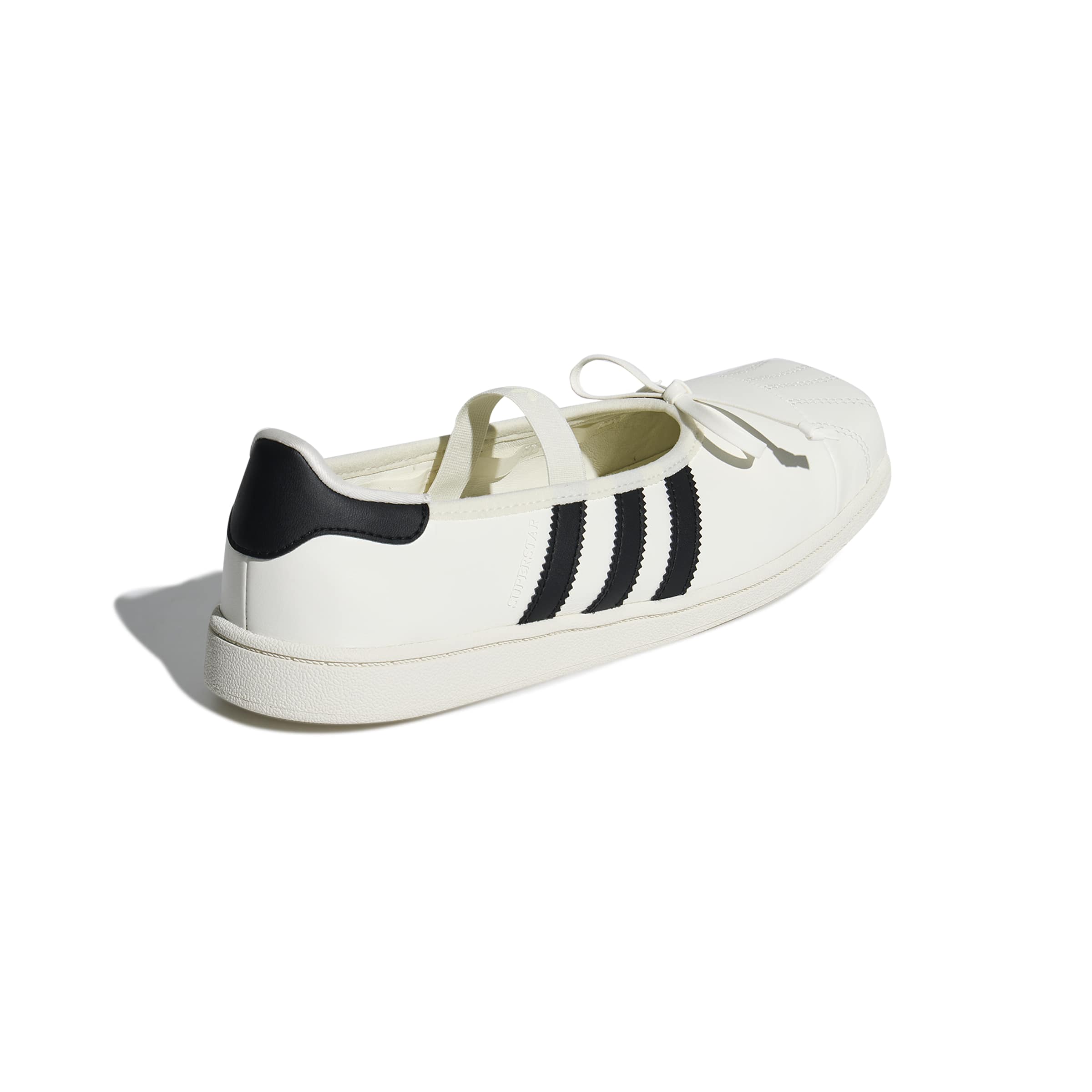 white and black ballet sneakers on a white background