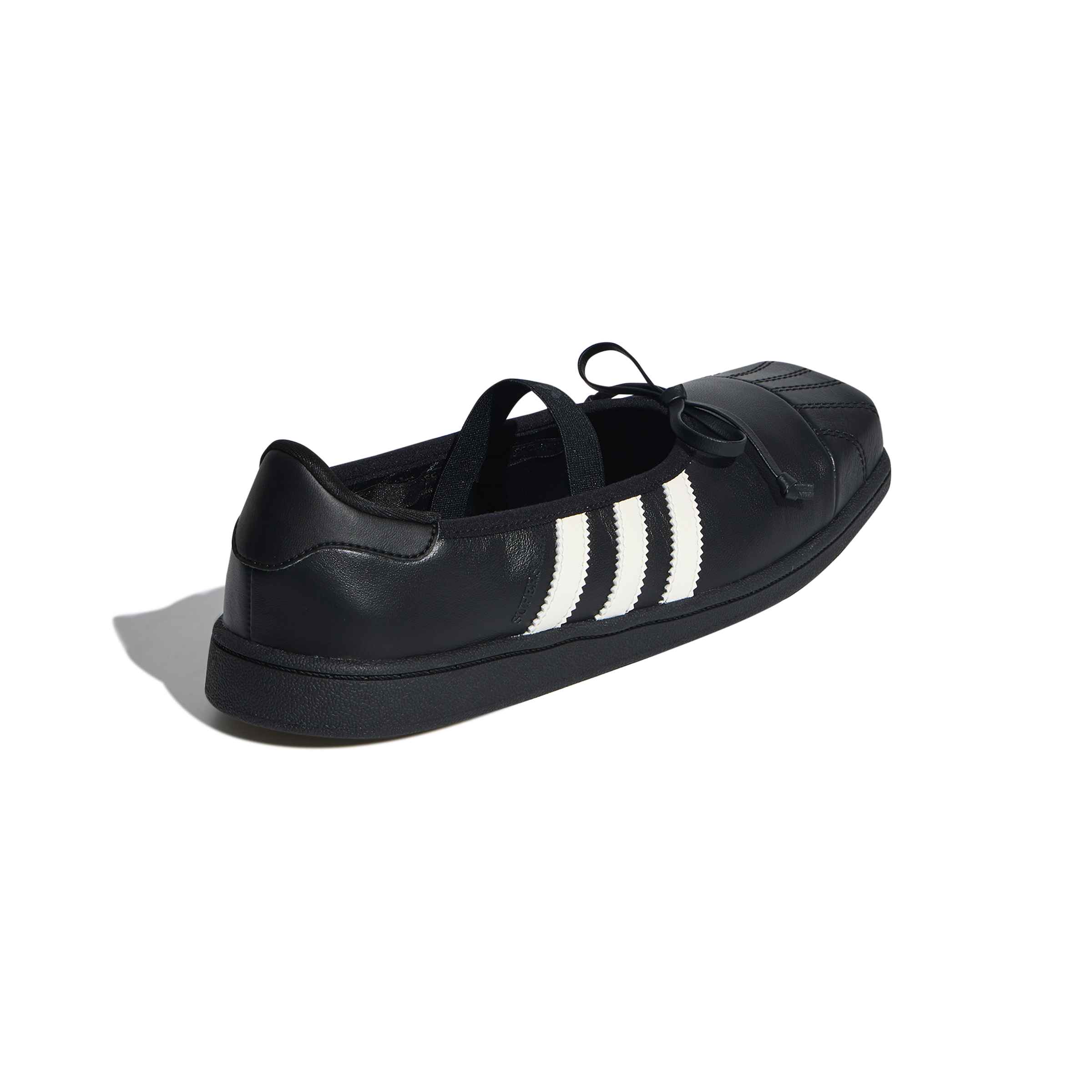 black and white ballet sneakers on a white background