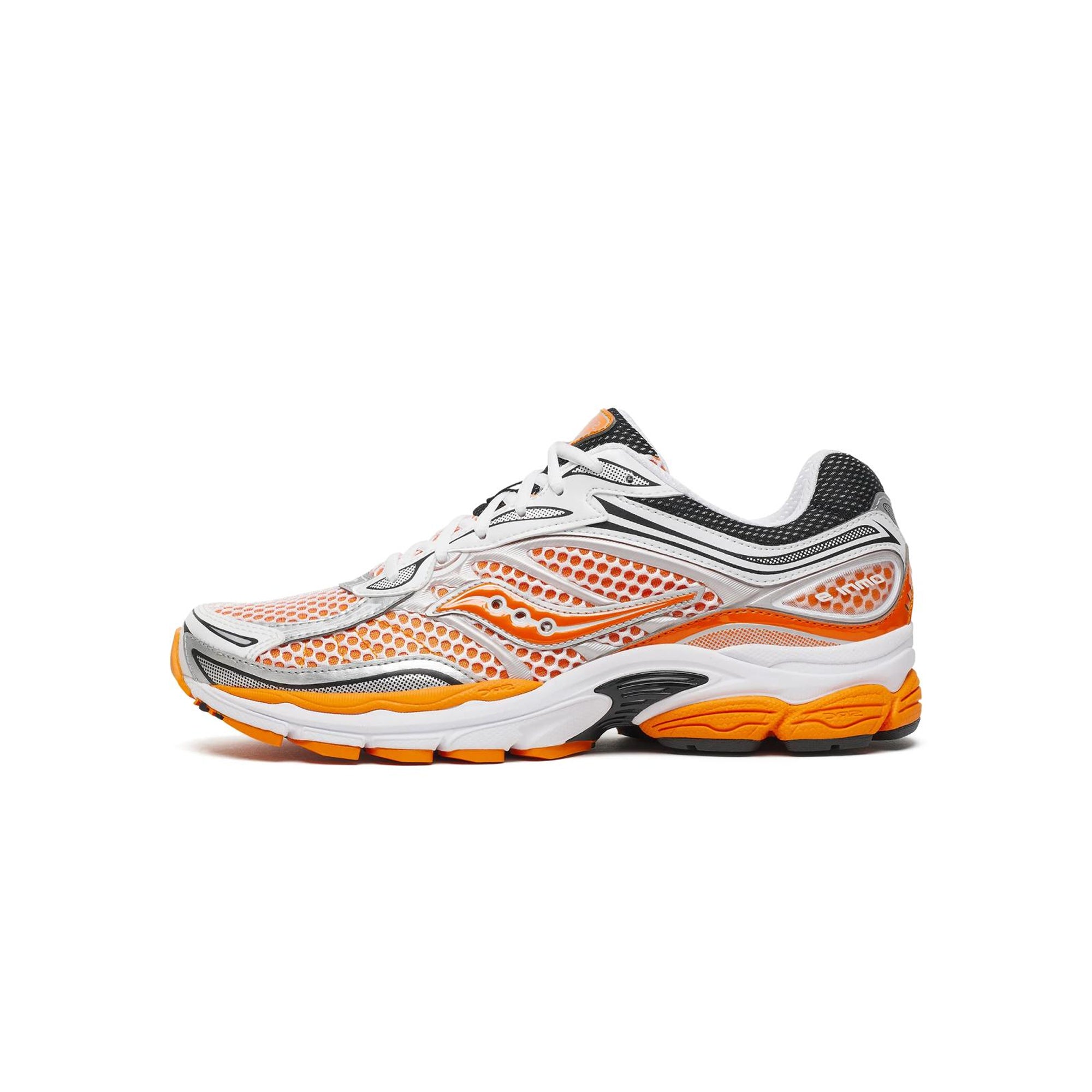 white orange black and silver sneakers on a white background