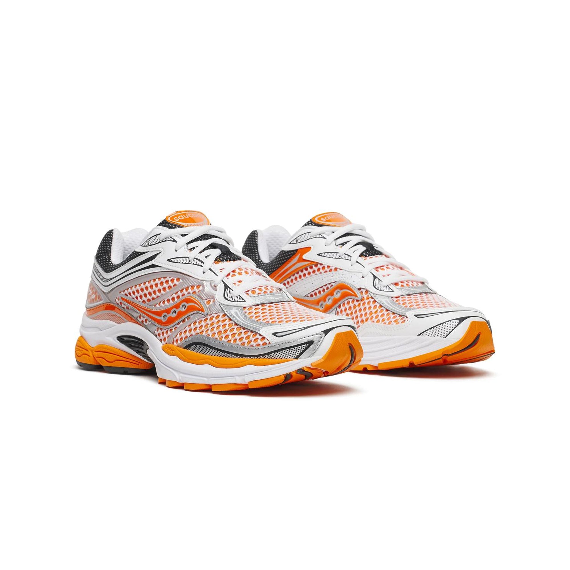 white orange black and silver sneakers on a white background