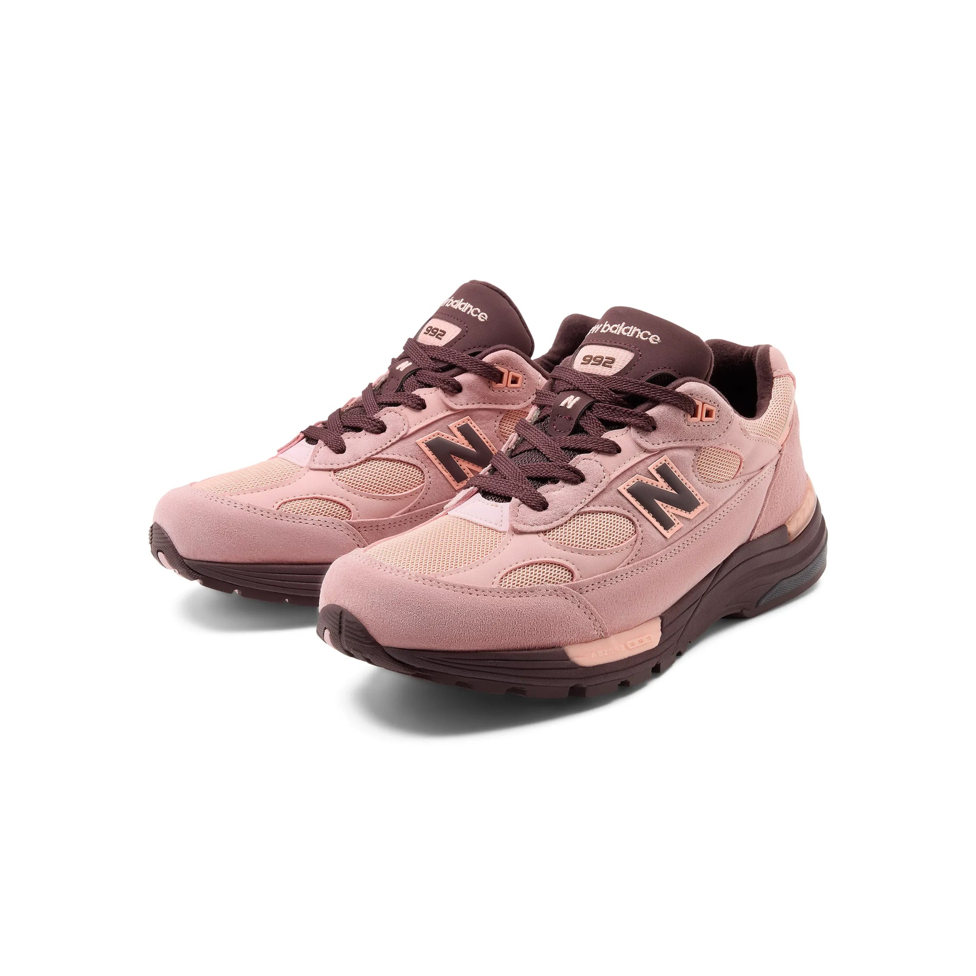 pink and brown sneakers on a white background