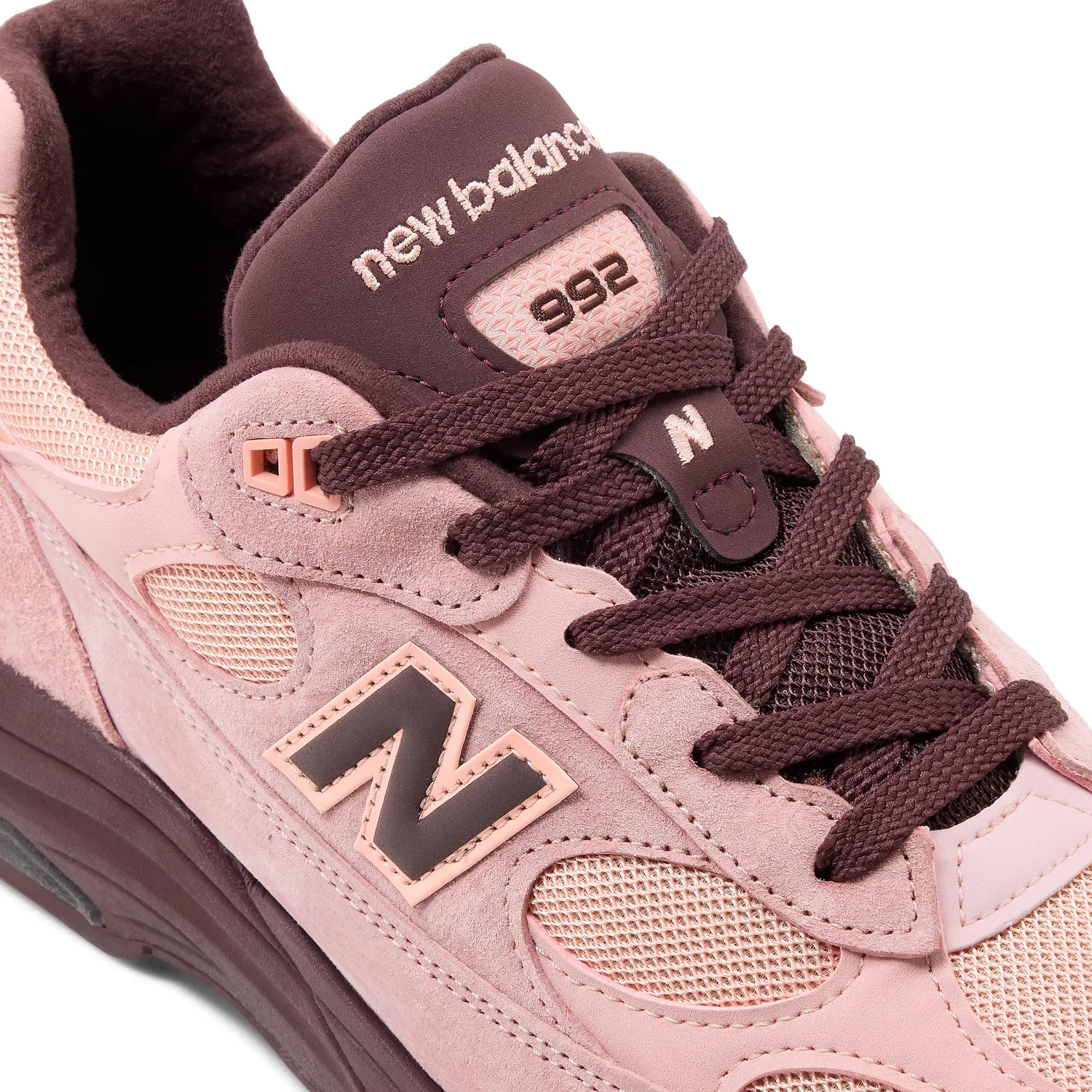 pink and brown sneakers on a white background