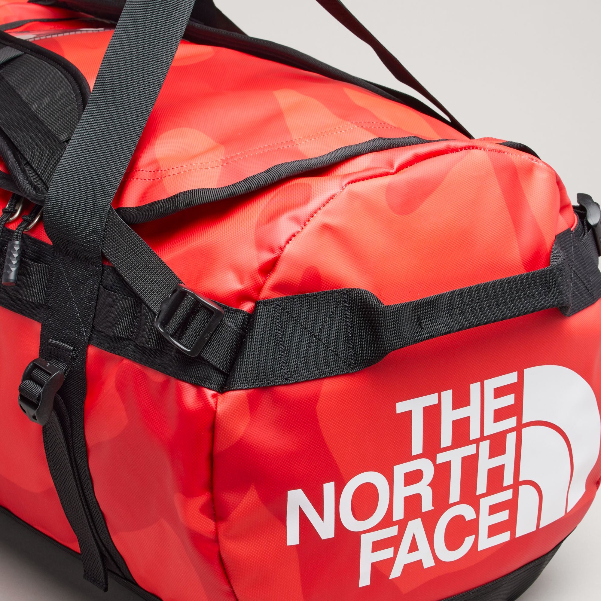 The North Face XX Kaws Basecamp Duffel Bag 'Brilliant Coral 86 Print'